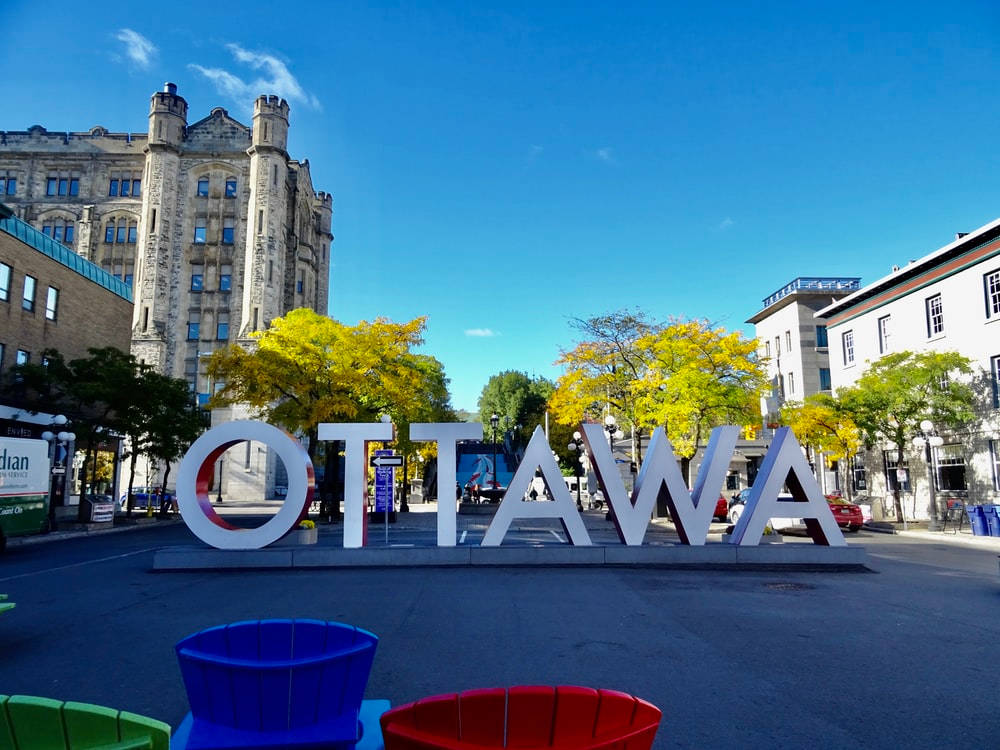Human-sized Ottawa Sign In Ottawa Byward Market Background