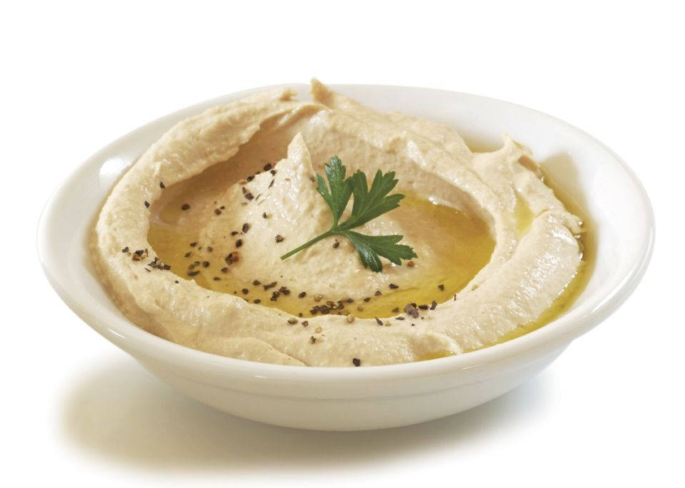 Caption: Delicious hummus served in a white bowl Wallpaper
