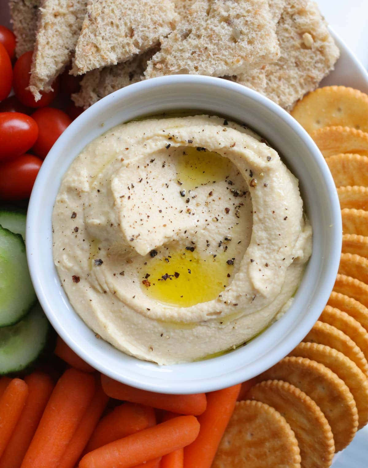 Hummus With Crackers And Vegetables Wallpaper