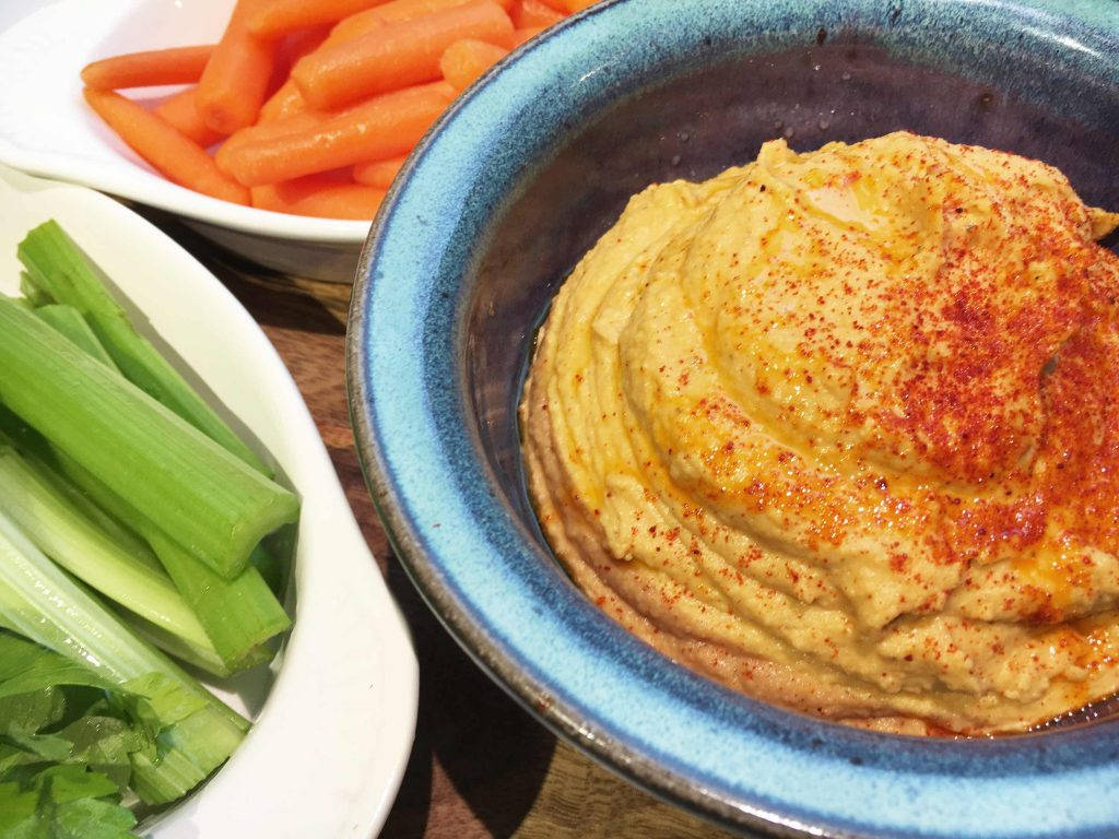 Vibrant Hummus Bowl with Fresh Veggies Wallpaper