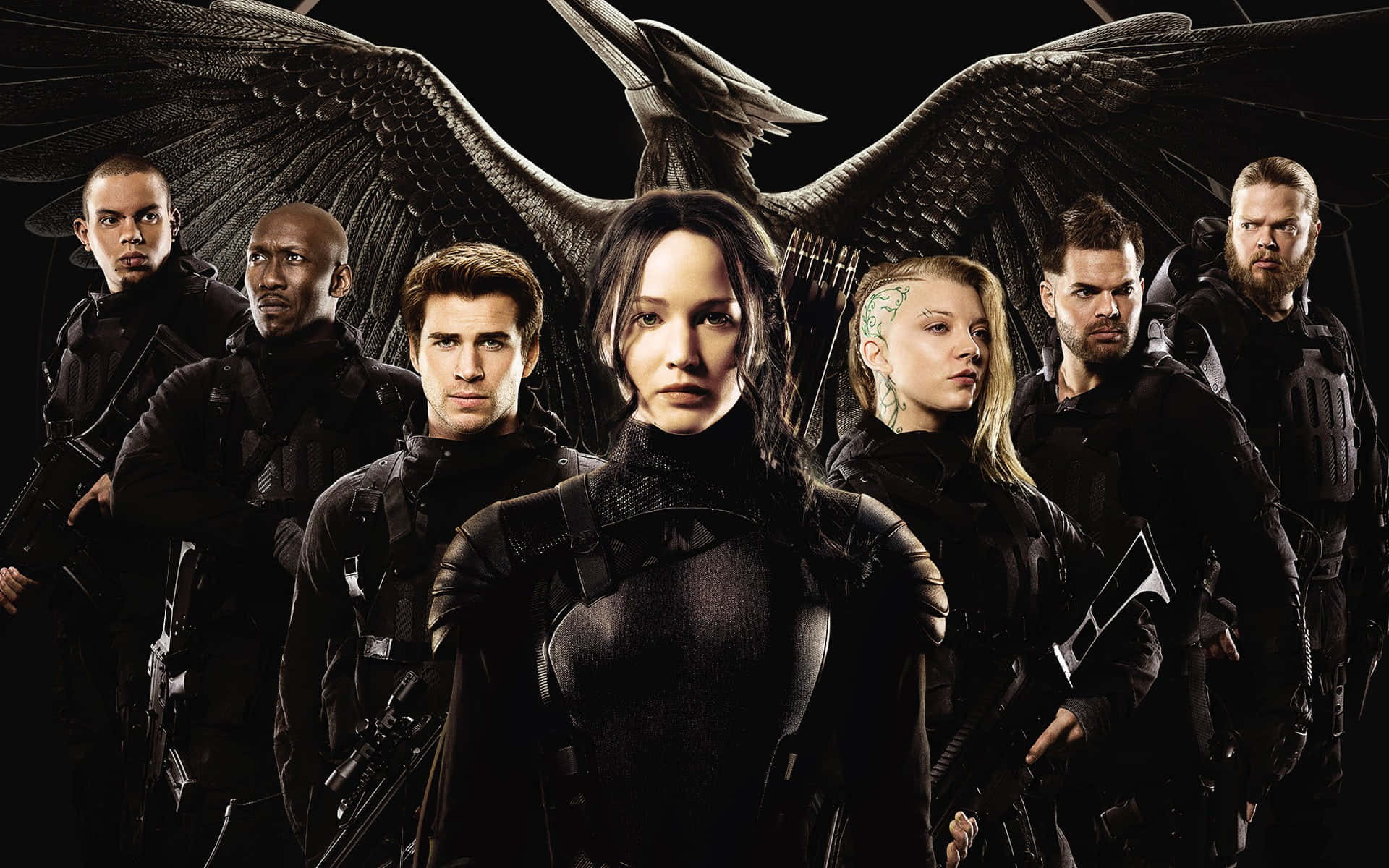The Hunger Games Poster With The Characters In Front Of A Bird