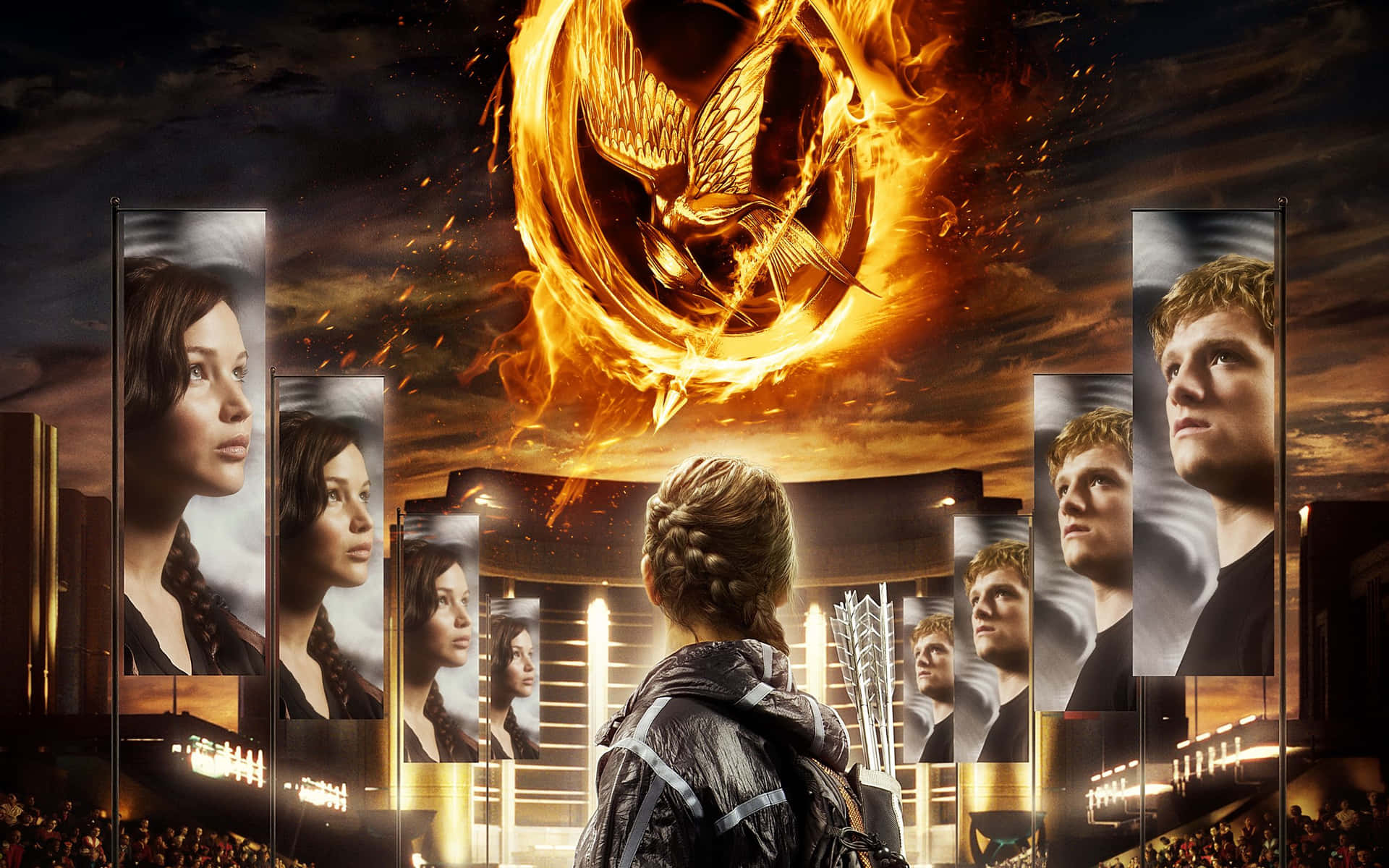 The Hunger Games Poster With A Woman In Front Of A Fire