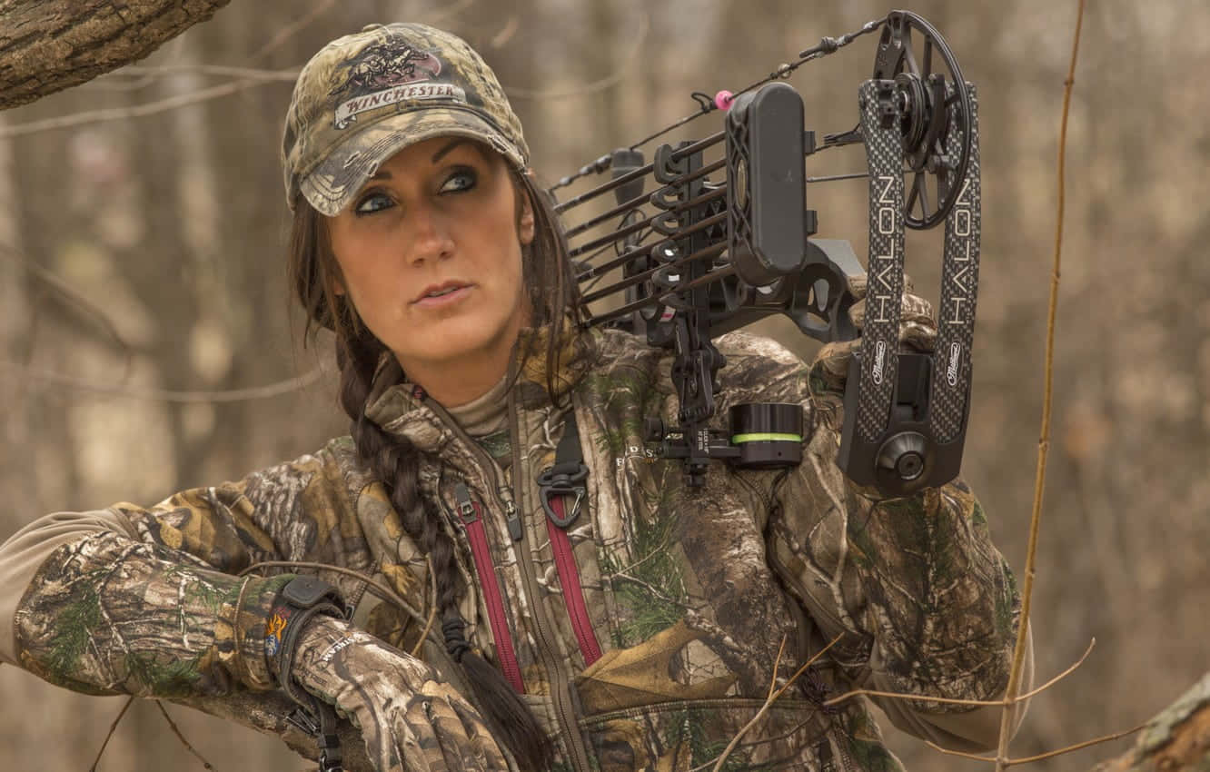 Woman In Hunting Camo With Bow Wallpaper