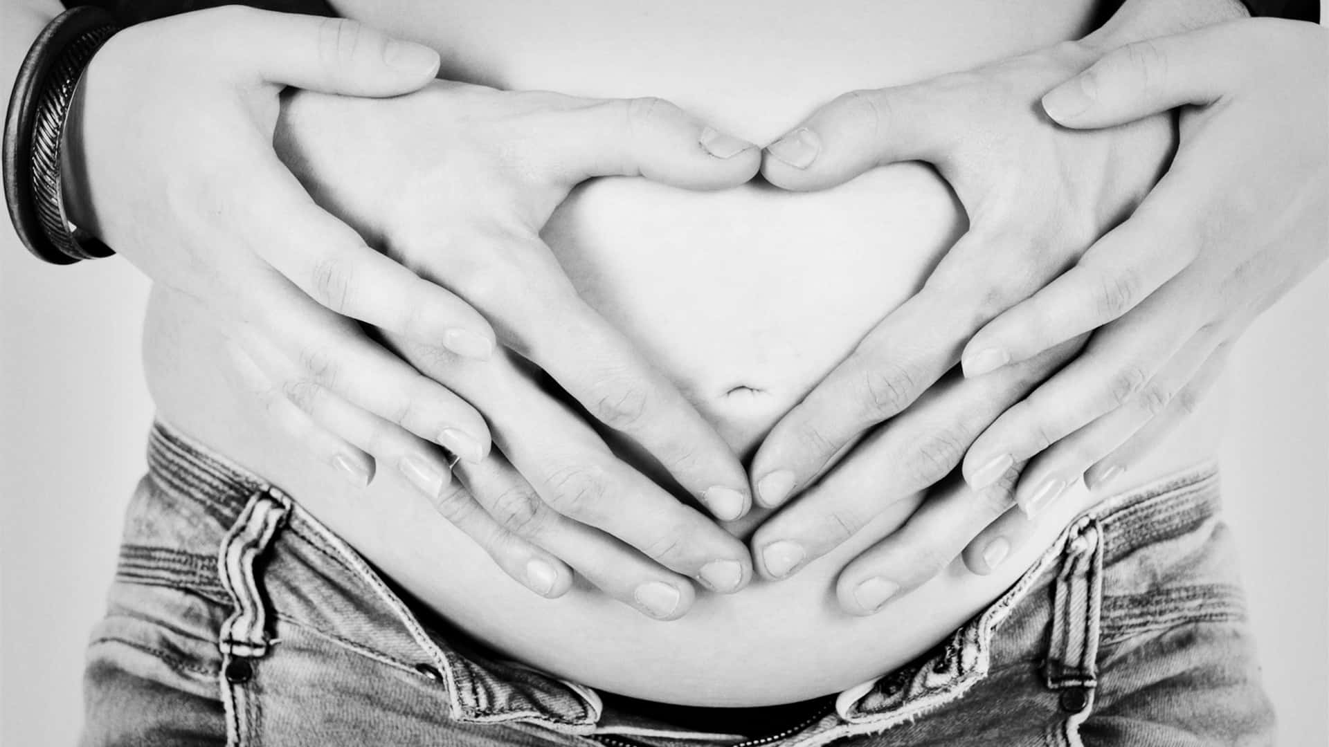 Husband And Wife Pregnant Hand Heart Wallpaper