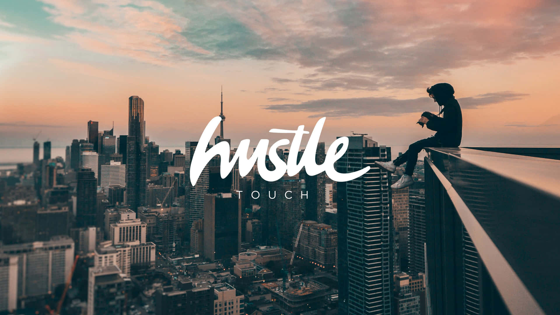 Hustle - A Cityscape With A Person Sitting On A Ledge Wallpaper