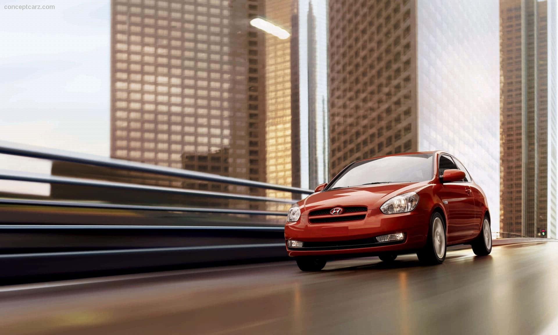 Hyundai Accent in motion on a sleek urban landscape Wallpaper