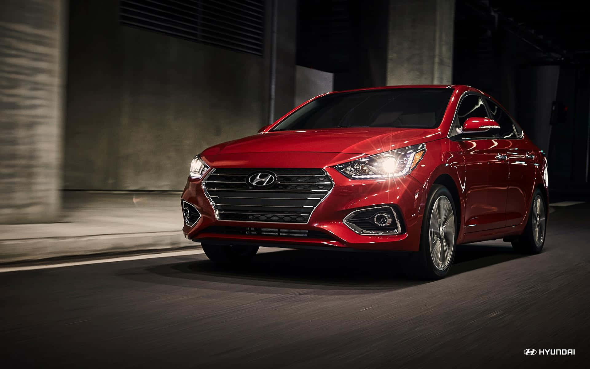 Sleek Red Hyundai Accent on the Road Wallpaper