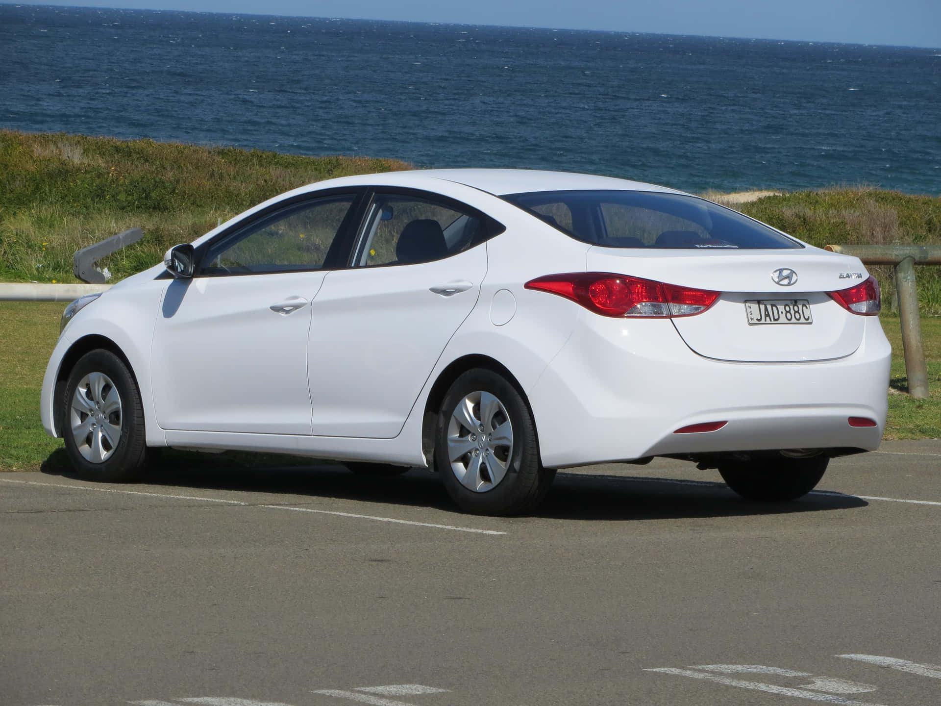 Sleek and stunning Hyundai Elantra in a beautiful city backdrop Wallpaper