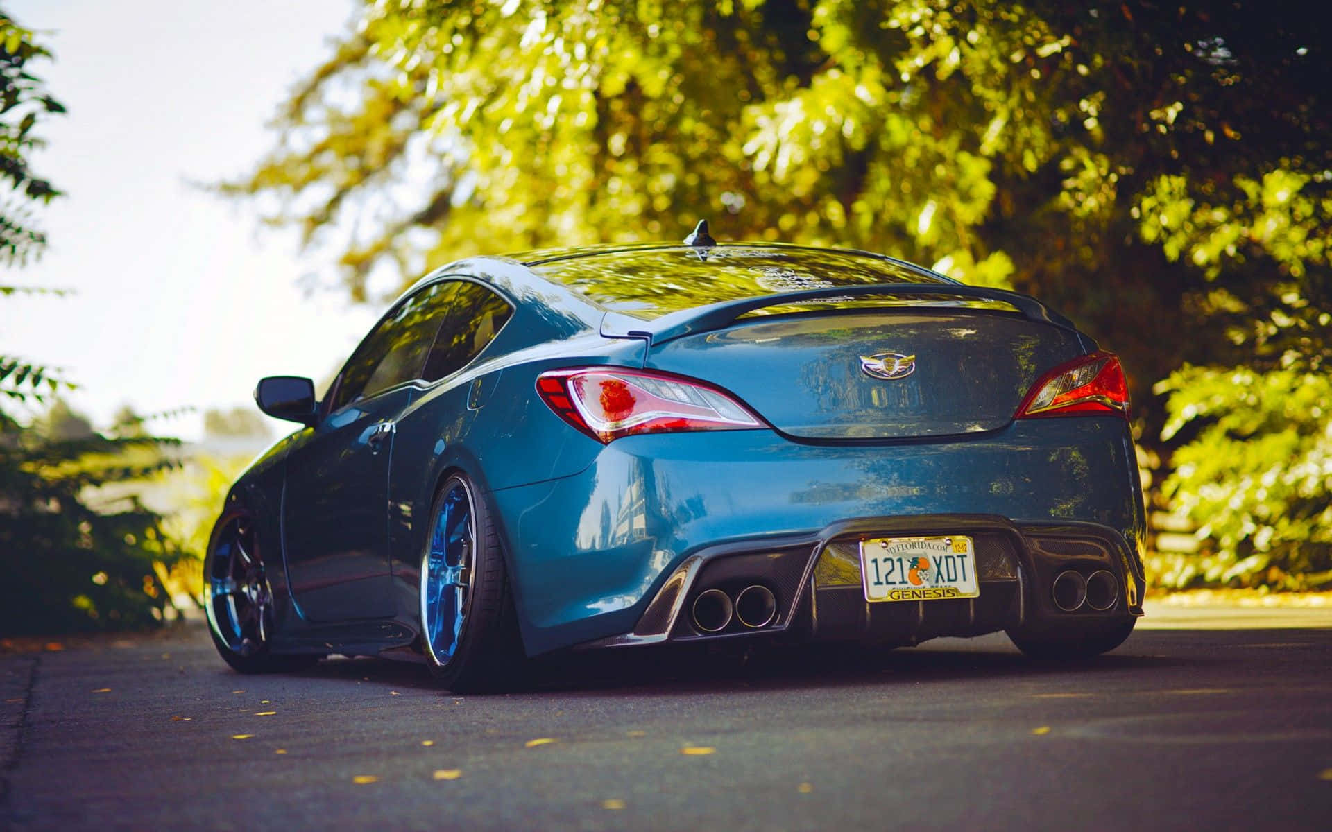 Sleek Hyundai Genesis in a Scenic Cityscape Wallpaper