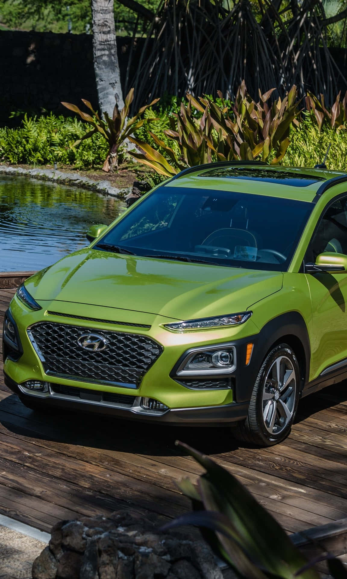 Eye-catching Hyundai Kona on a dynamic road Wallpaper