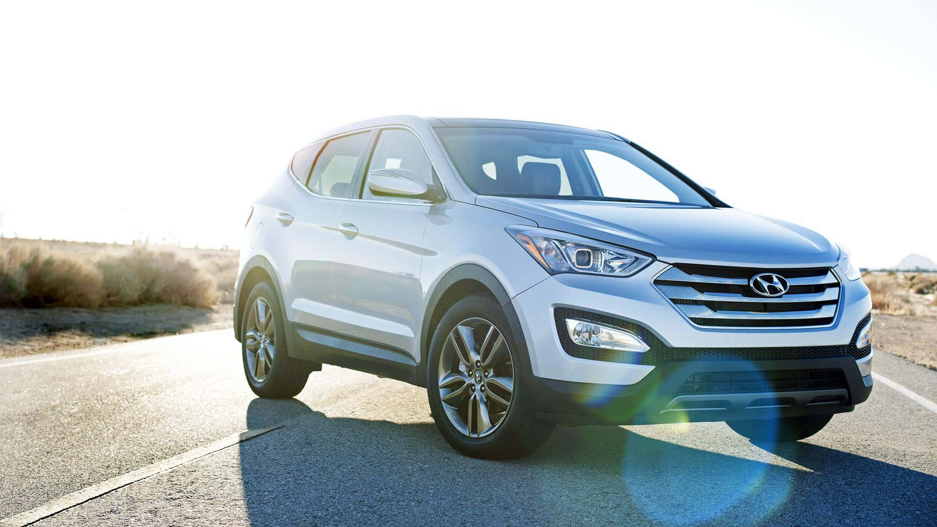 Sleek Hyundai Santa Fe on Scenic Route Wallpaper