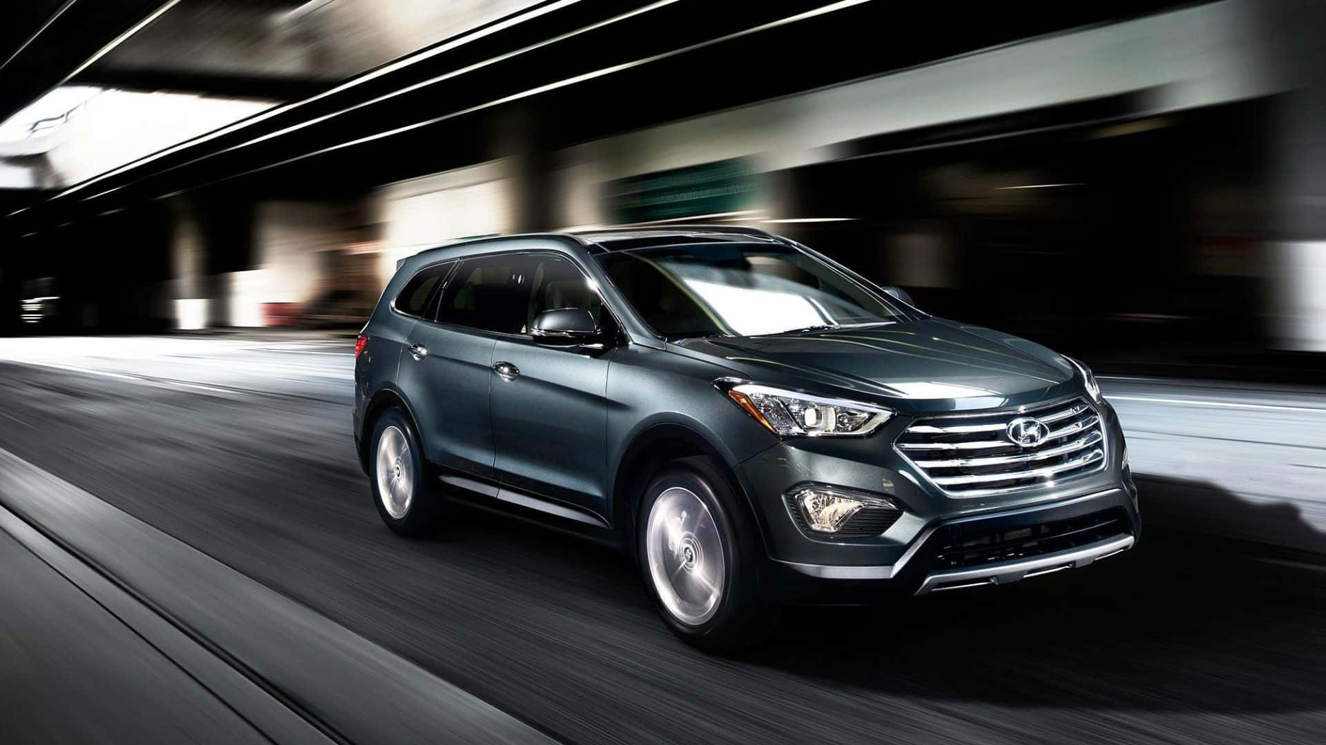 Sleek Hyundai Santa Fe on the scenic countryside road Wallpaper