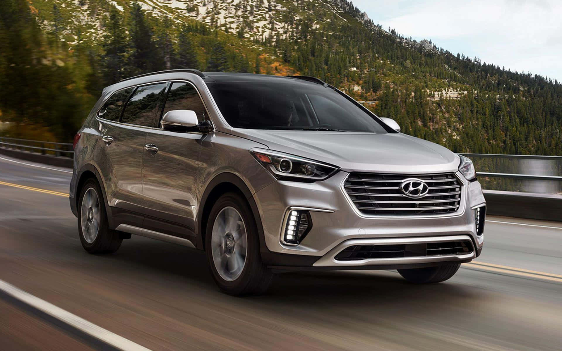 Sleek and Stylish 2022 Hyundai Santa Fe on the Road Wallpaper