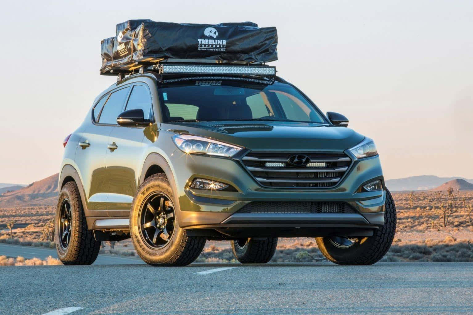 Sleek Hyundai Tucson on the road Wallpaper