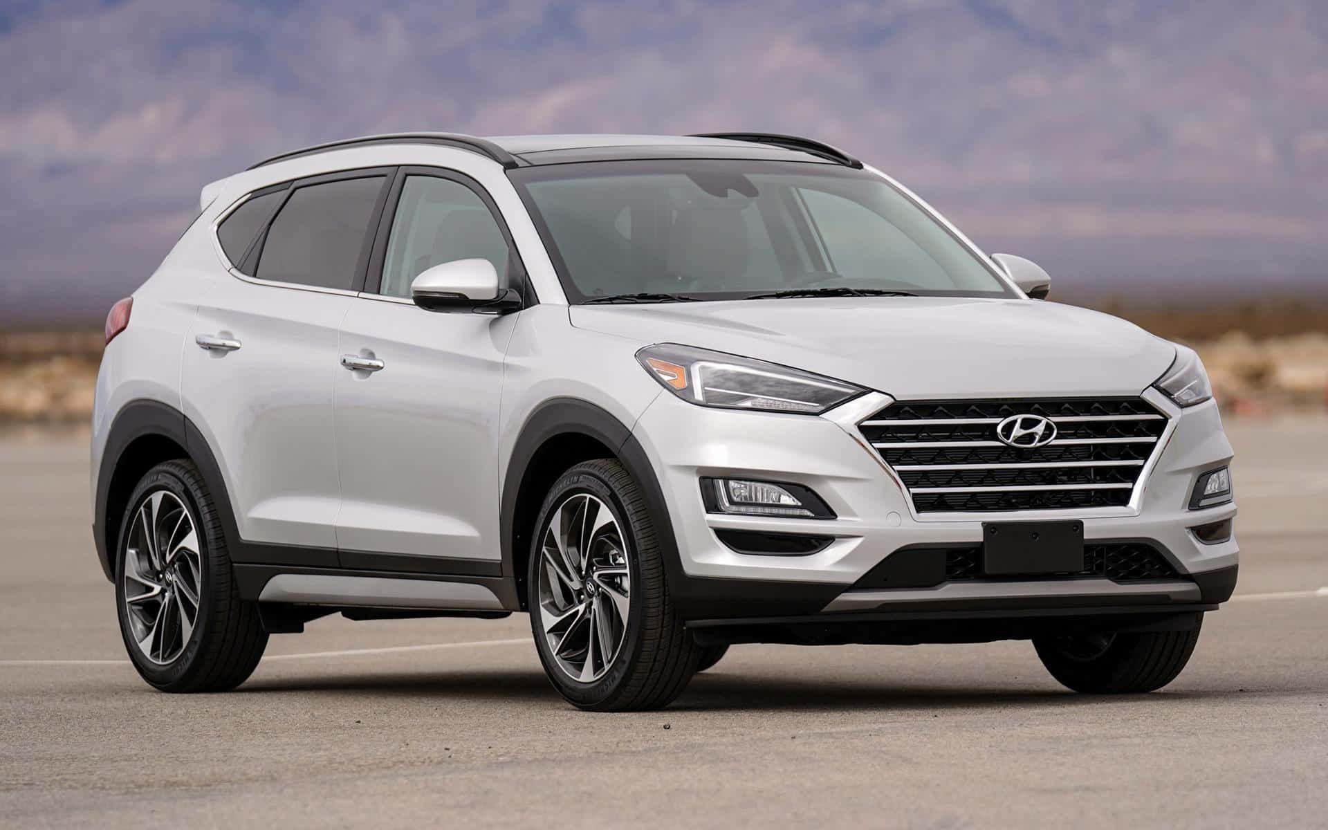 Sleek Hyundai Tucson on a Scenic Drive Wallpaper