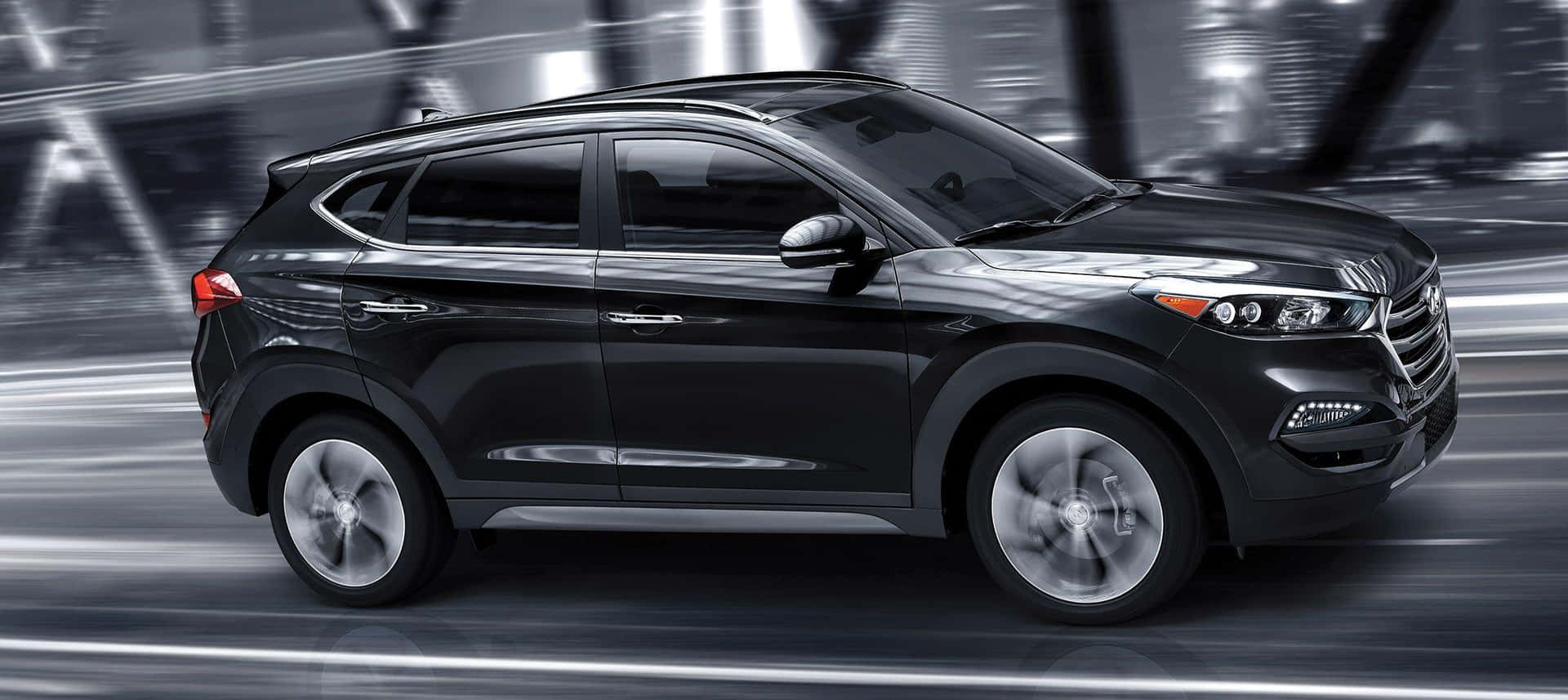 Sleek Hyundai Tucson on the Road Wallpaper