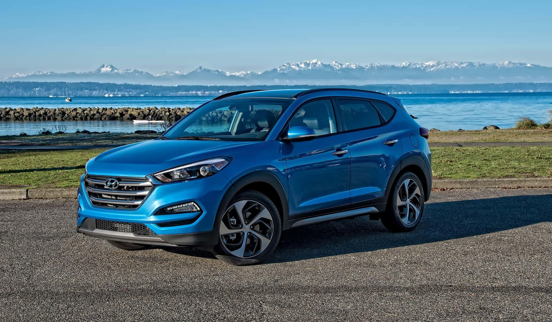 Hyundai Tucson SUV on a scenic road Wallpaper