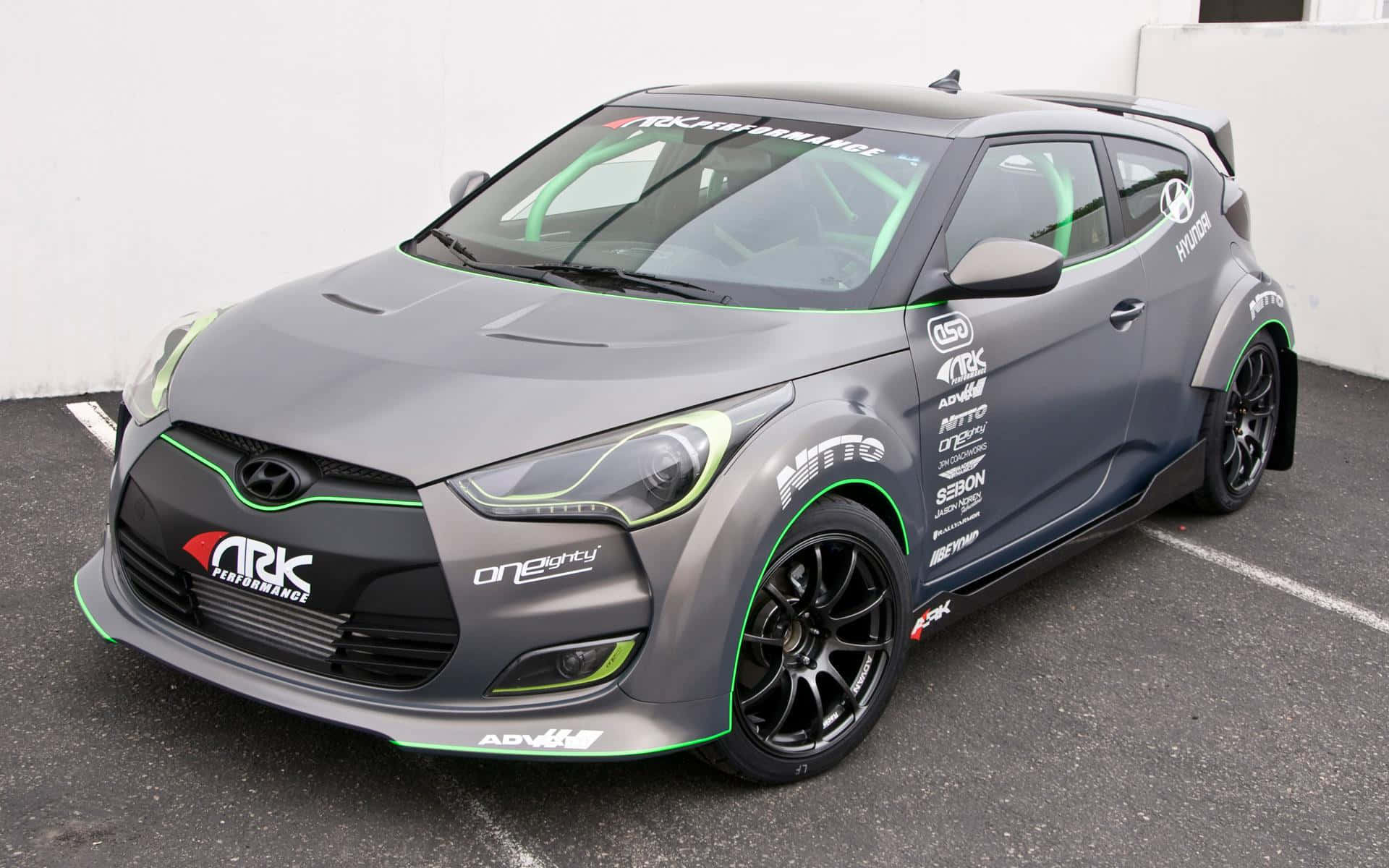 Sleek Hyundai Veloster in action Wallpaper