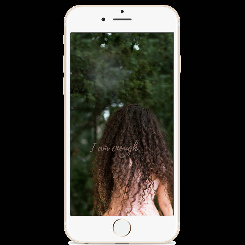 A Woman With Curly Hair Is Standing In Front Of A Tree Wallpaper