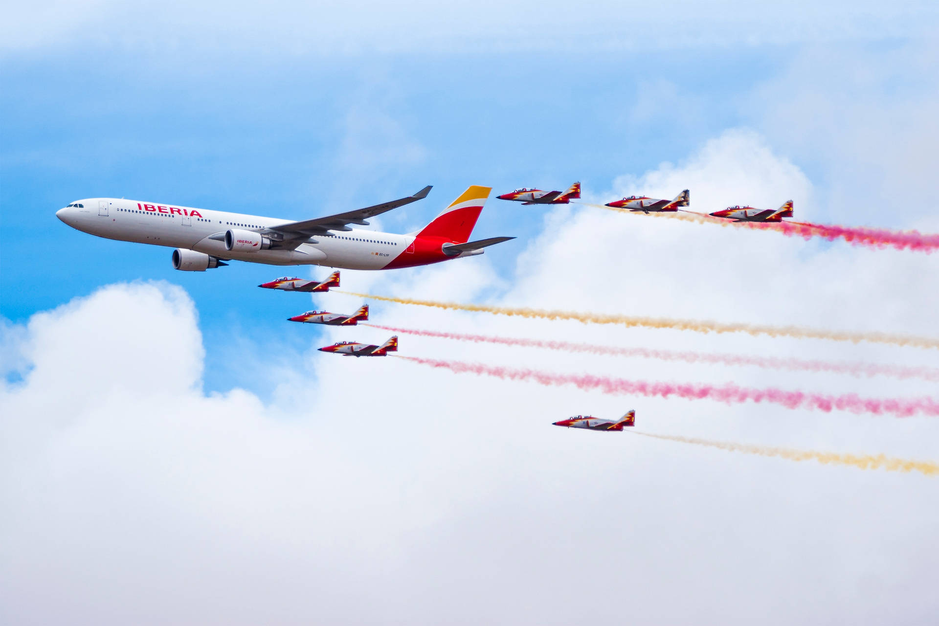 Iberia Airlines flyvemaskiner med farverige røgstier Wallpaper