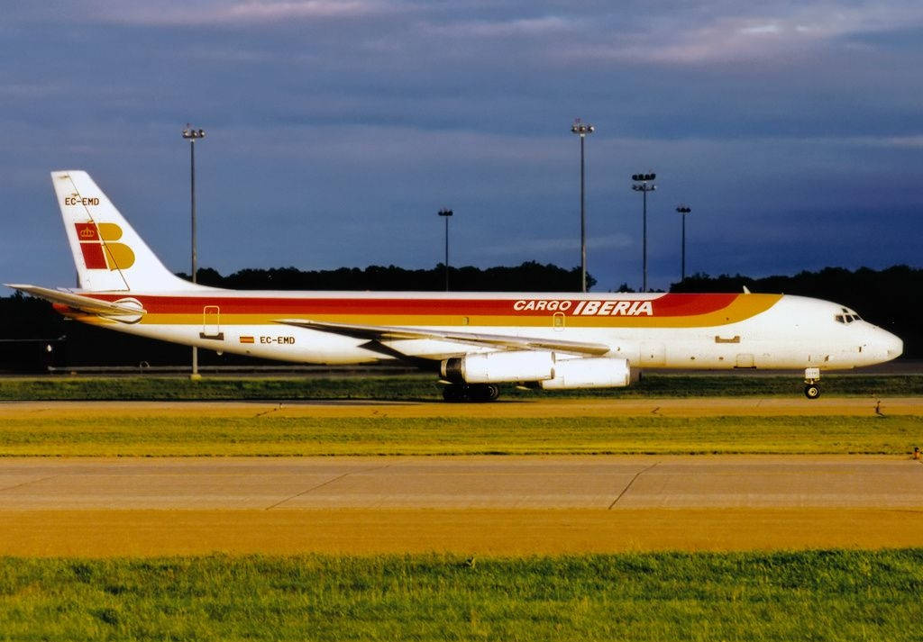 Iberia Airlines Airplane On Green Runway Wallpaper