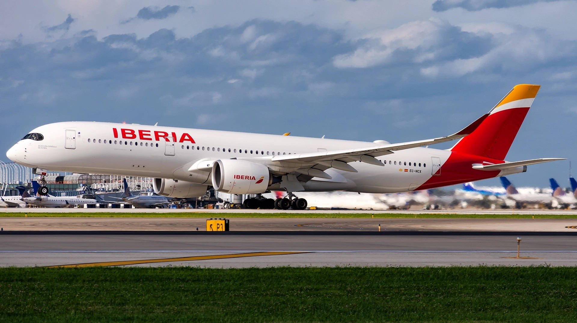 Iberia Airlines Airplanes On Busy Airport Wallpaper