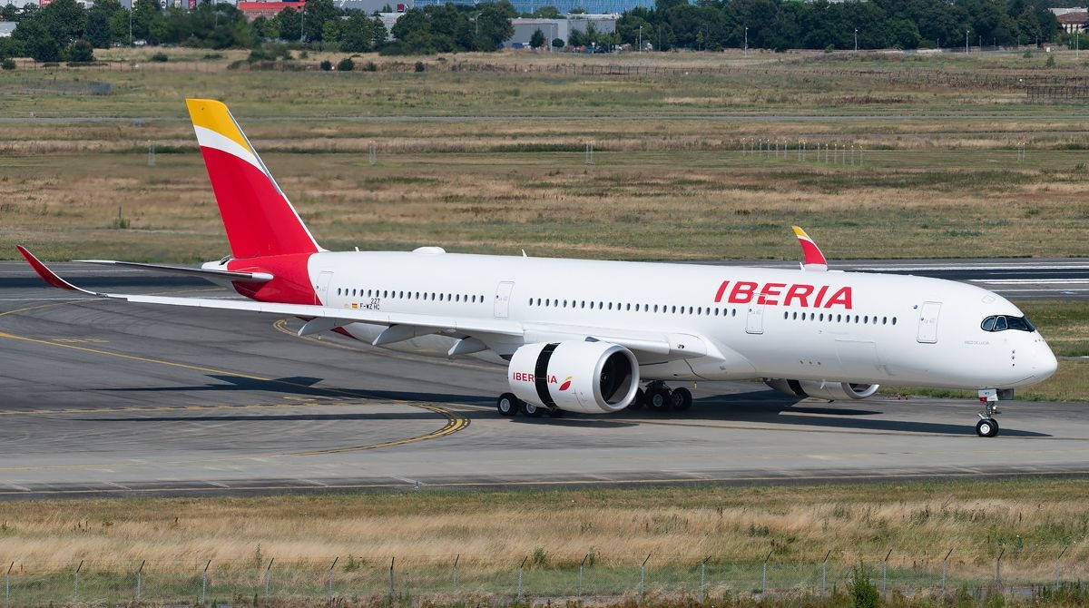 Iberia Airlines Passenger Airplane On Runway Wallpaper