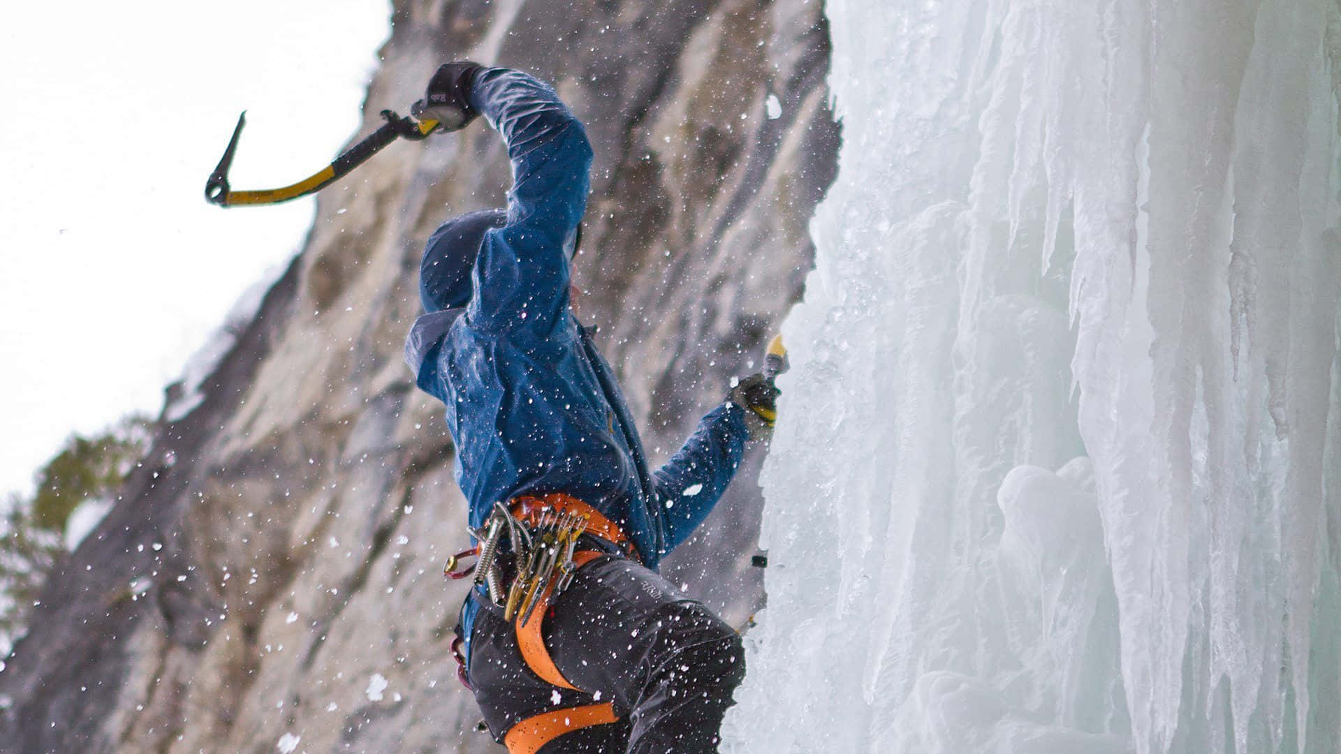 Thrilling Ice Climbing Adventure in a Winter Wonderland Wallpaper