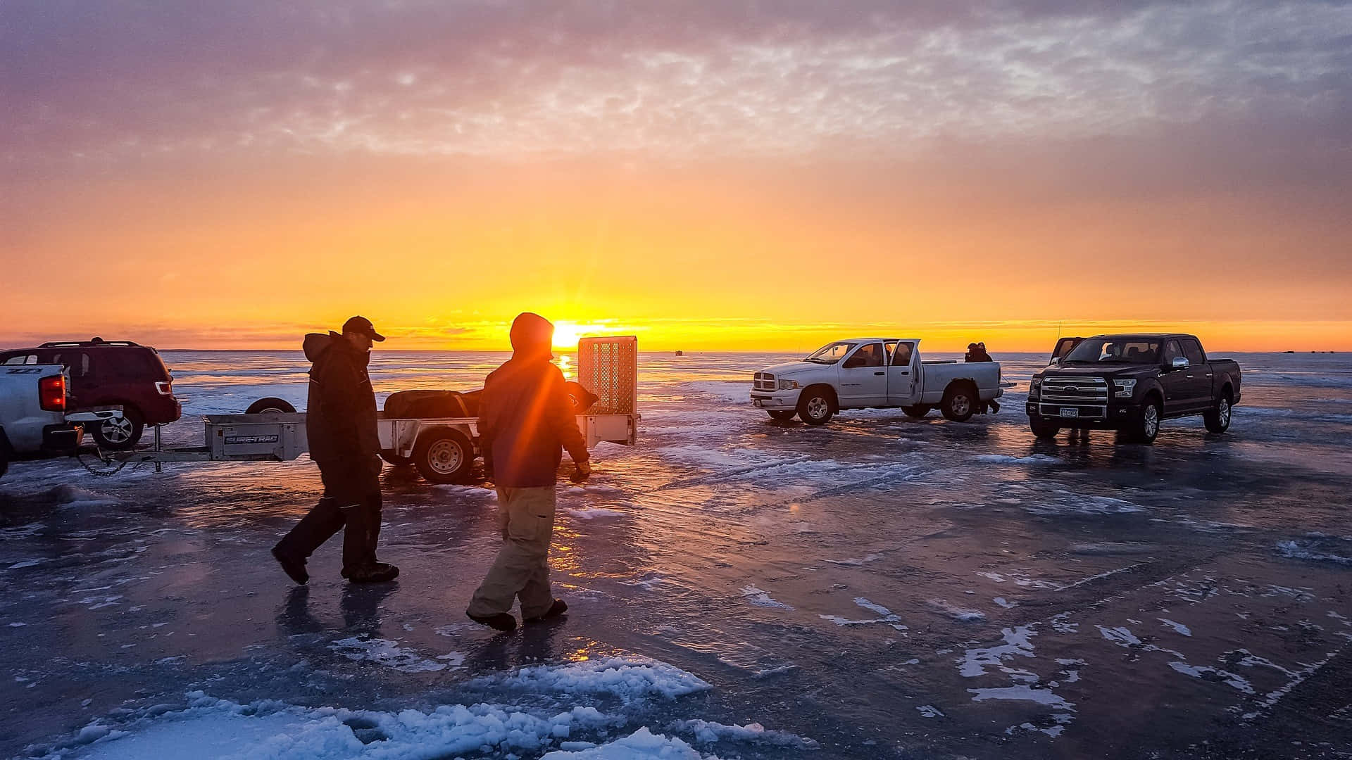 Ice Fishing Adventure on a Frozen Lake Wallpaper
