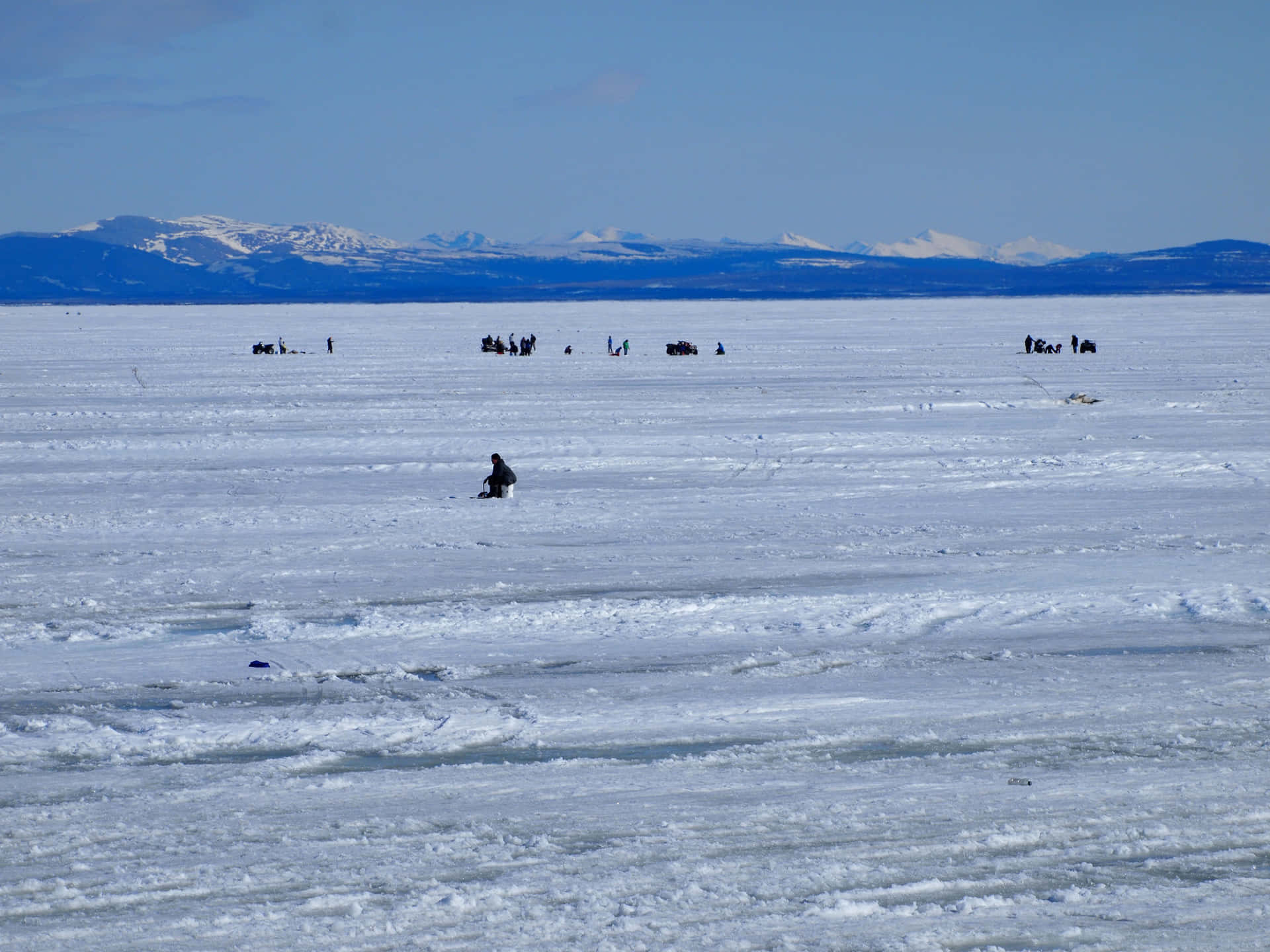 Ice Fishing on a Frozen Lake Wallpaper