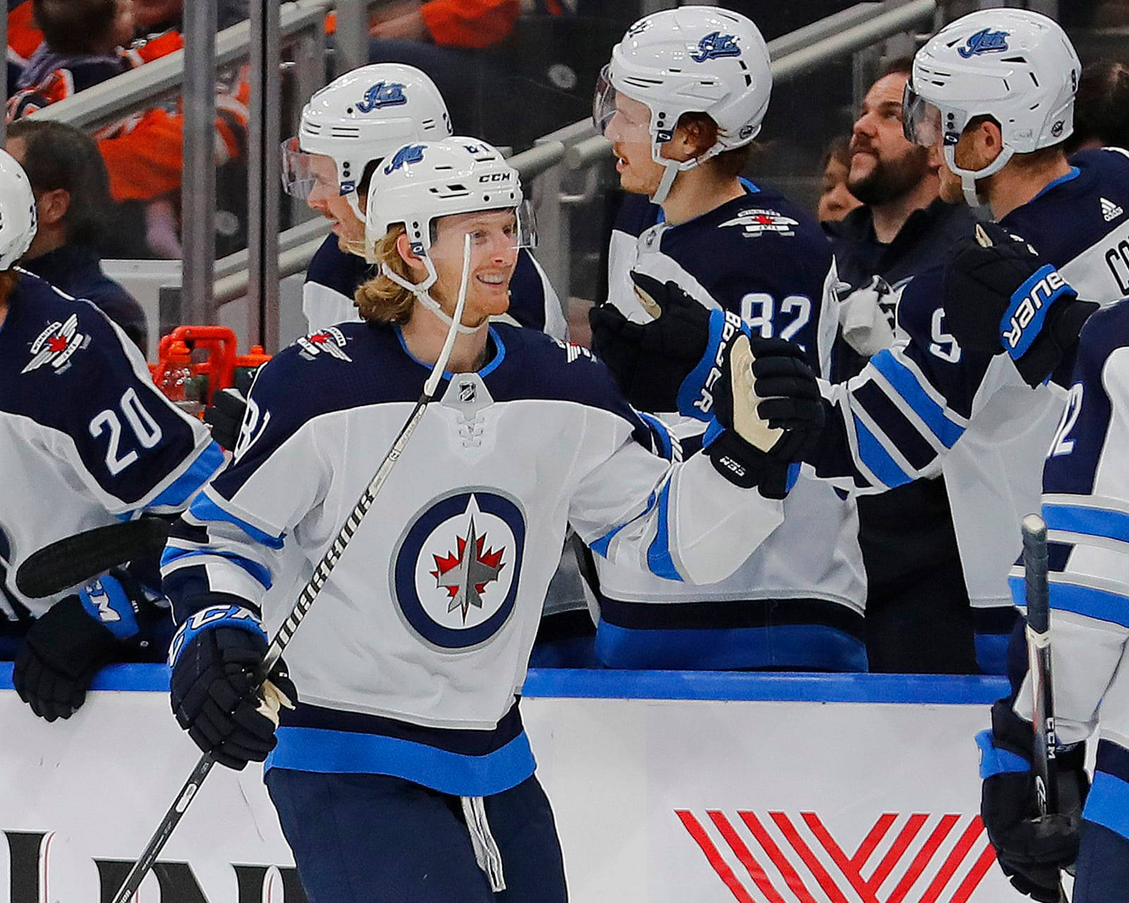 Ice Hockey Star Kyle Connor in action with Winnipeg Jets teammates Wallpaper