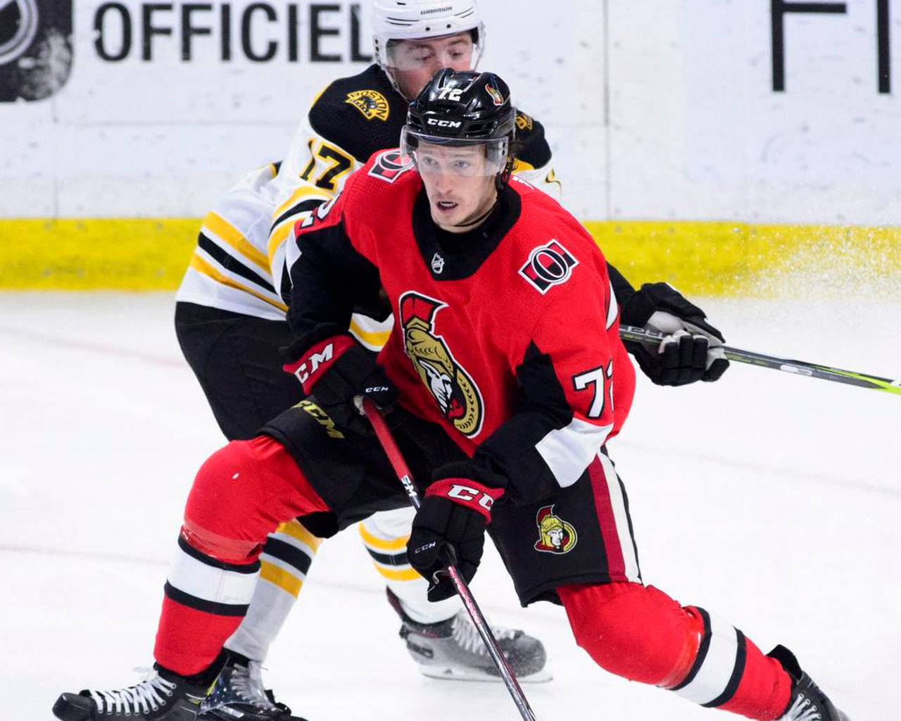 Thomas Chabot, Top-notch Professional Ice Hockey Player in Action Wallpaper