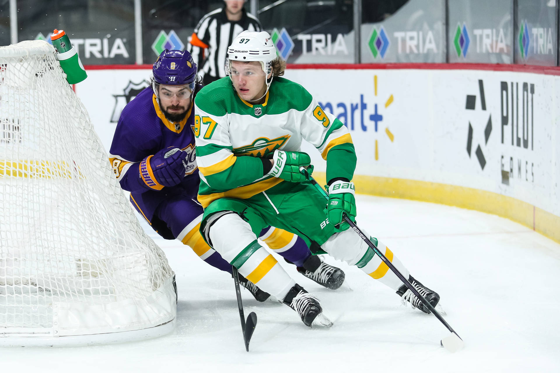 Ice Hockey Star Kirill Kaprizov Maneuvering Wallpaper