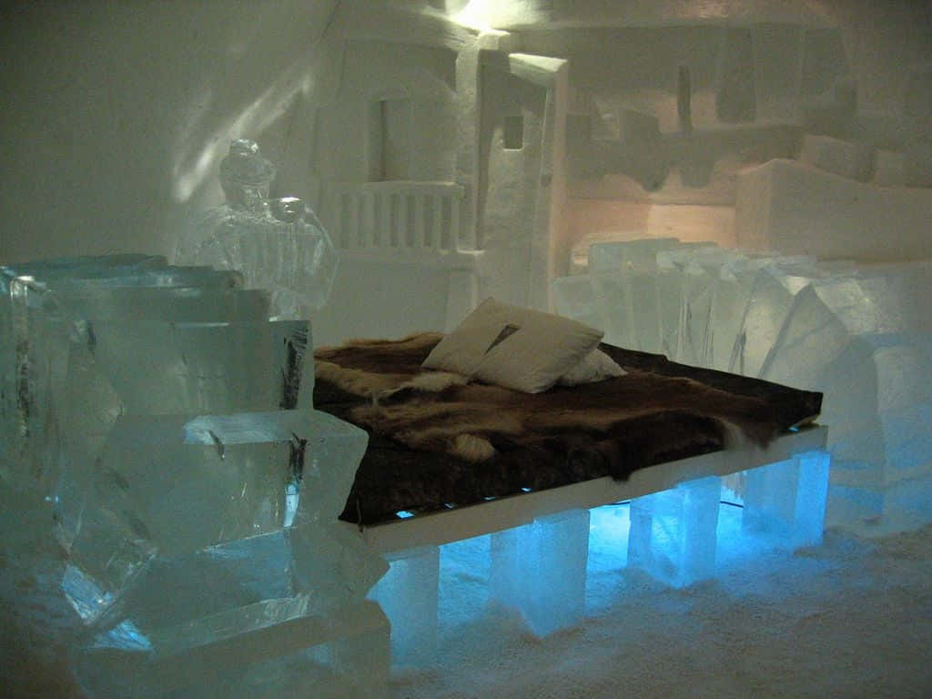 Magical Ice Hotel Suite Illuminated by Glowing Snowflakes Wallpaper