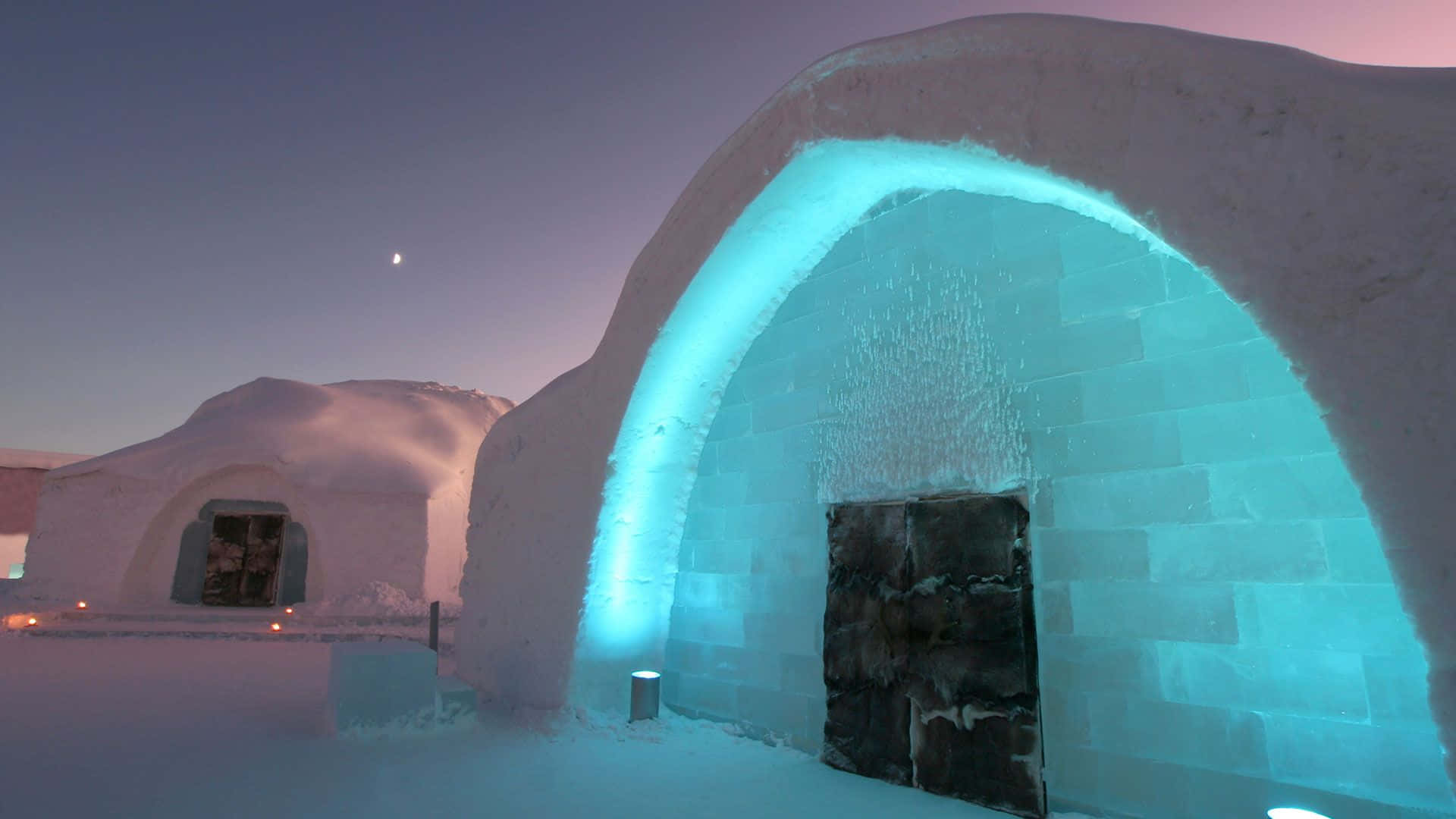 Stunning Ice Hotel Room with a Cozy Snowy Interior Wallpaper