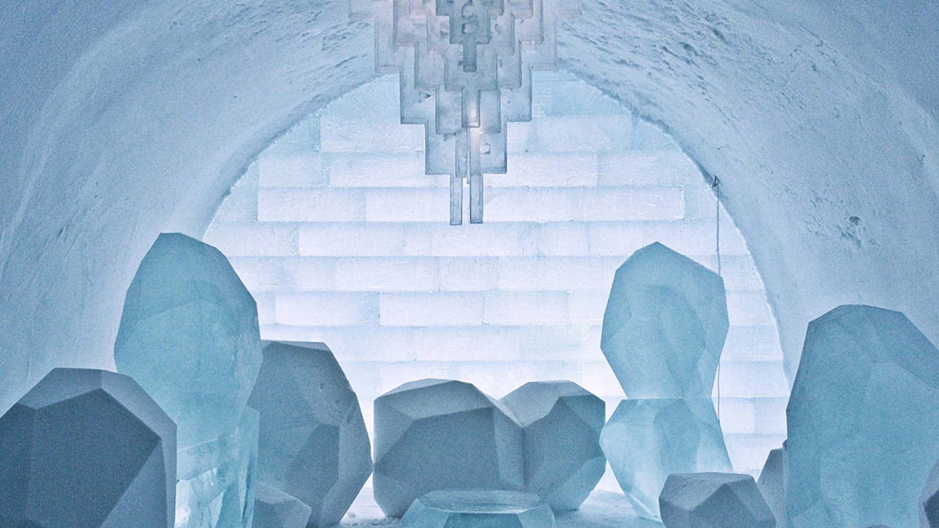 Majestic Ice Hotel Under the Starlit Sky Wallpaper
