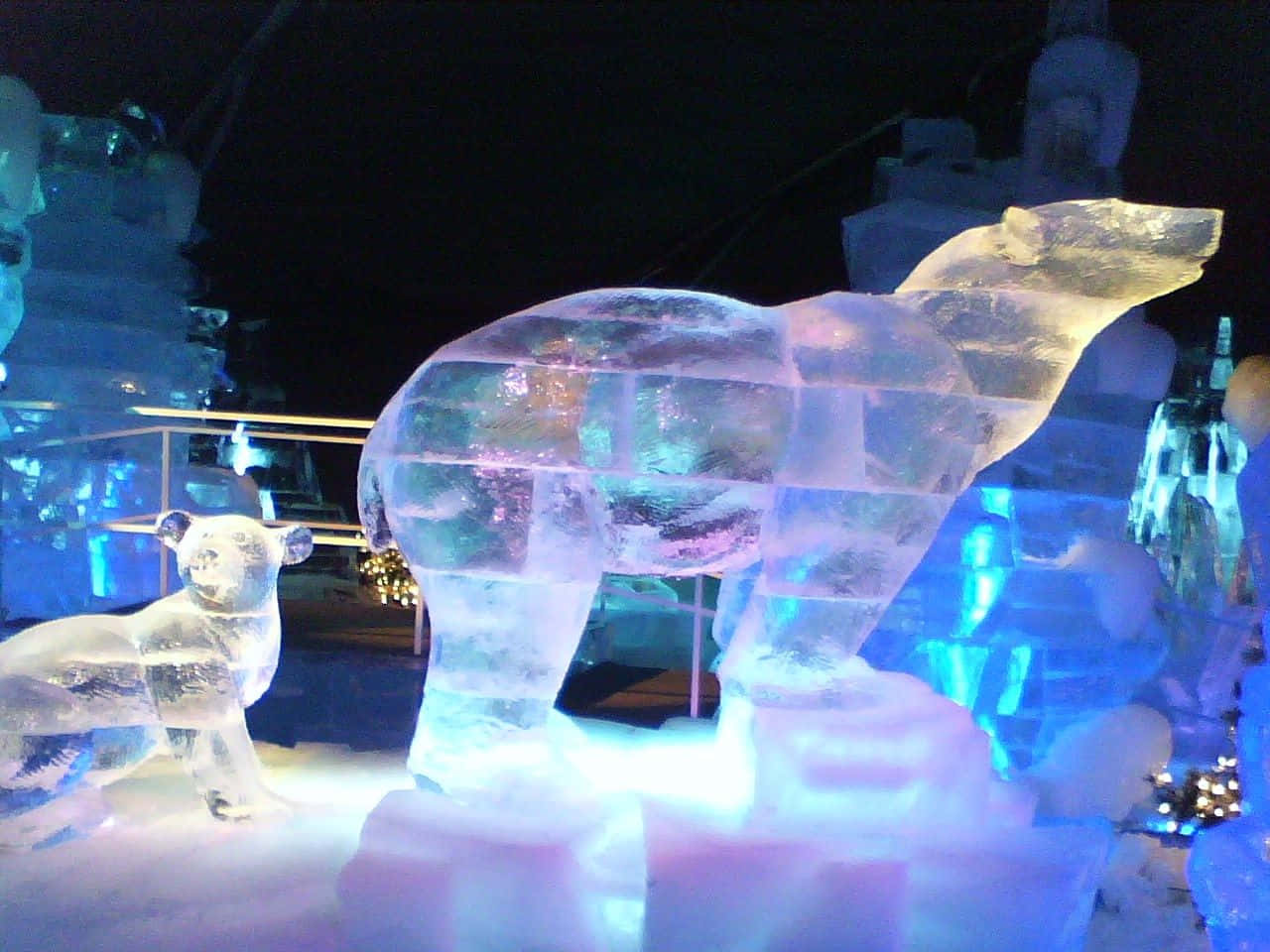 Caption: Majestic Ice Sculpture - Intricate Artistry on Display Wallpaper