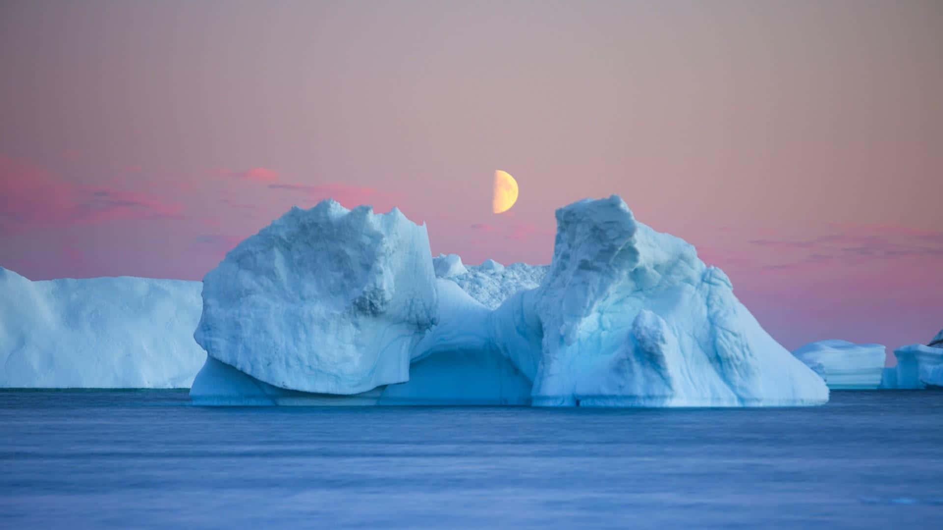 Stunning Iceberg Floating in Crystal Clear Waters Wallpaper