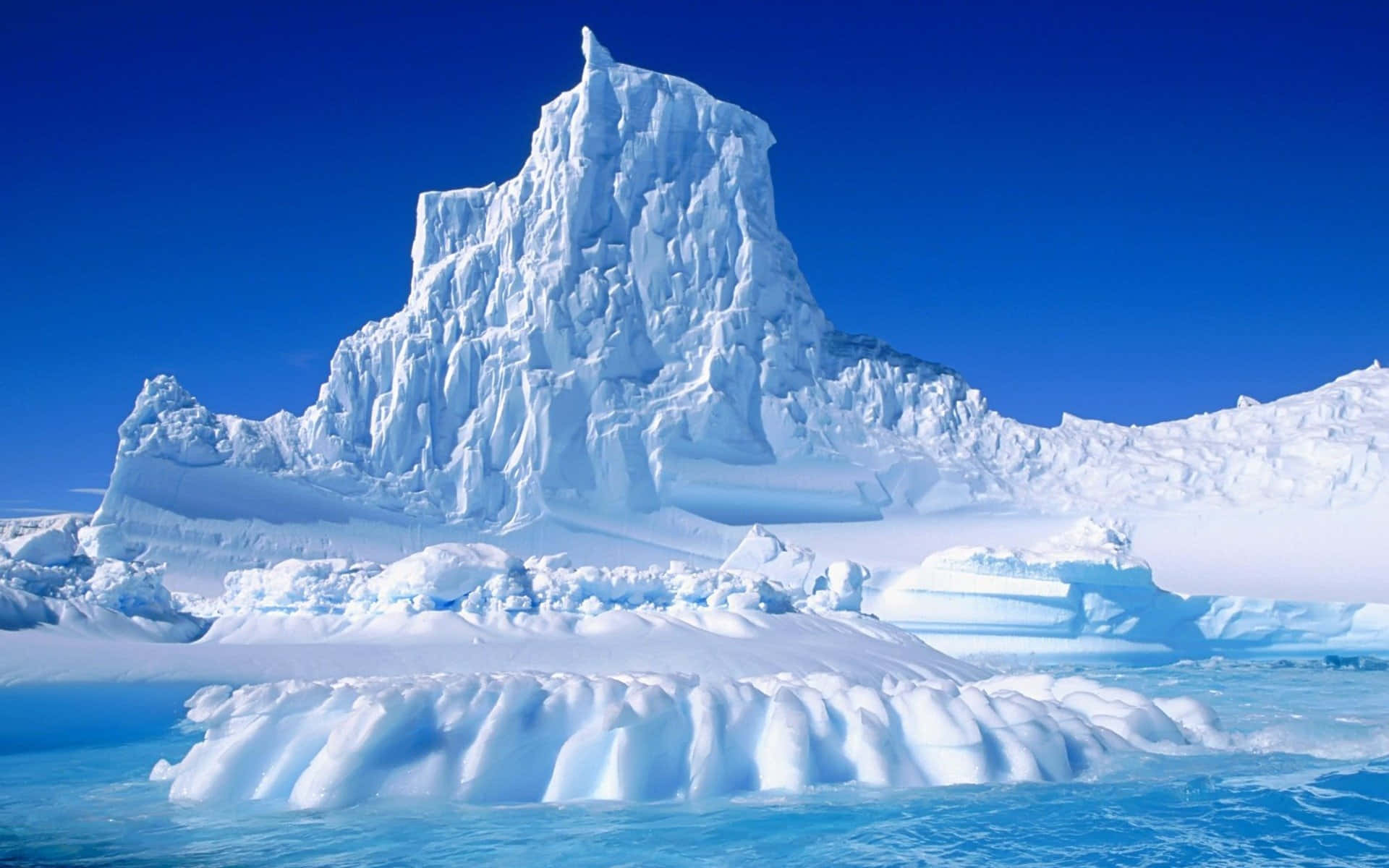Majestic Iceberg Floating in the Ocean Wallpaper