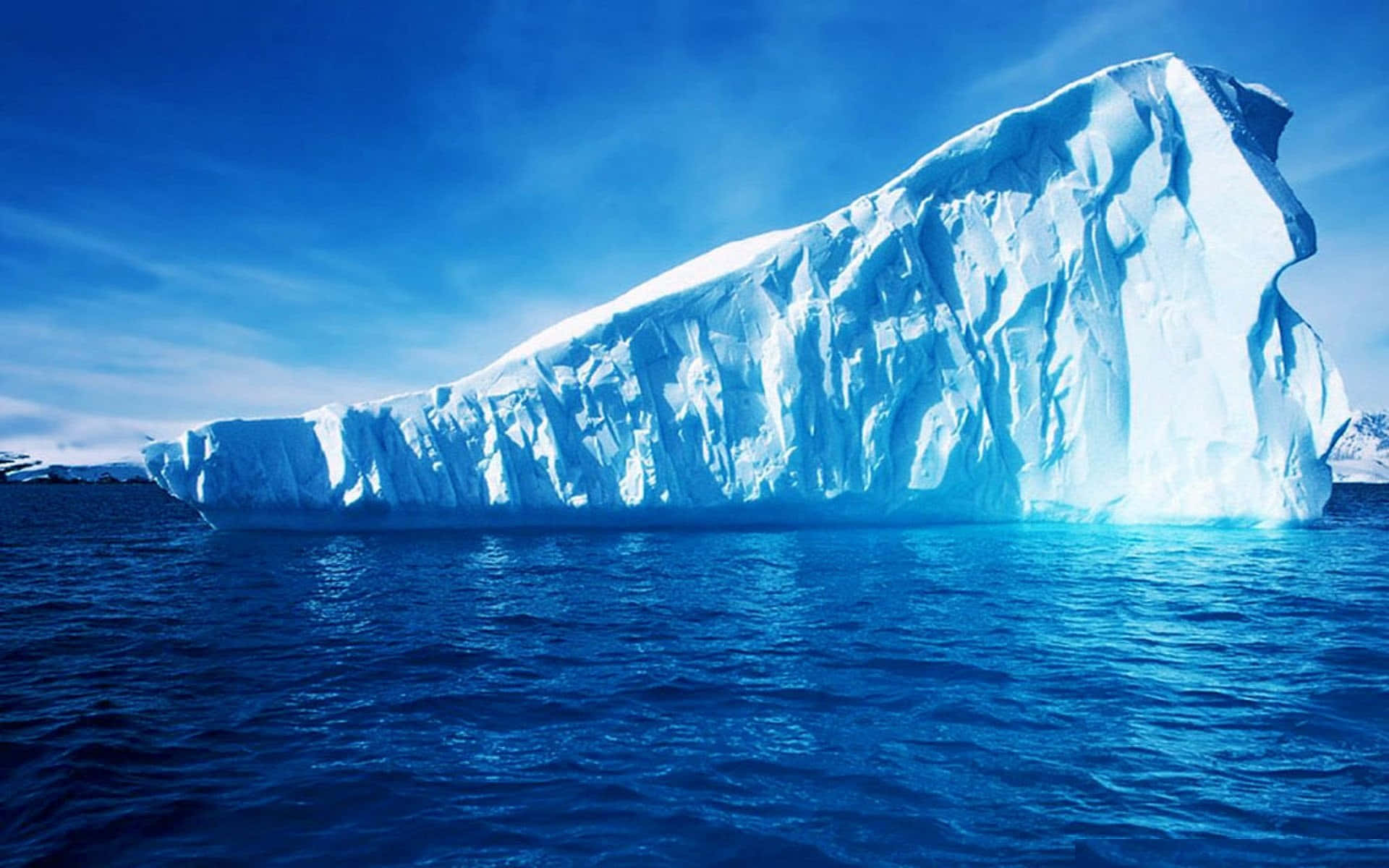 Majestic Iceberg on a Frozen Ocean Wallpaper