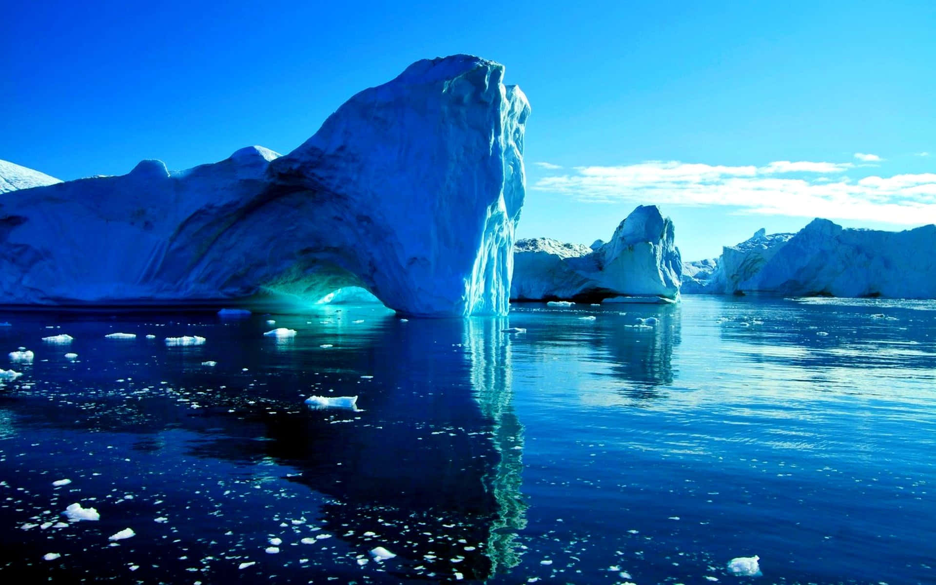 Majestic Iceberg Floating in Blue Ocean Wallpaper