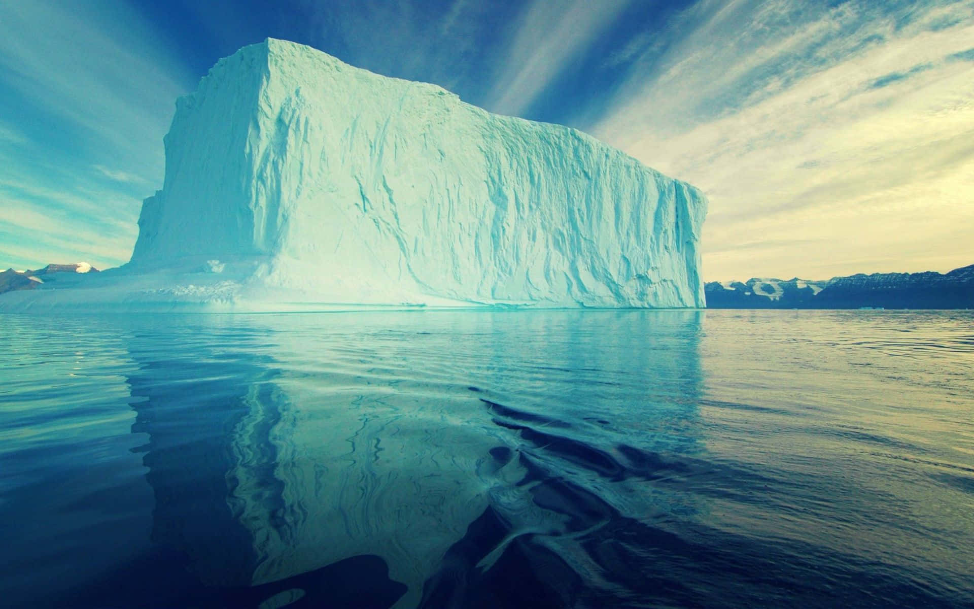 A mesmerizing view of an Iceberg in the middle of the ocean Wallpaper