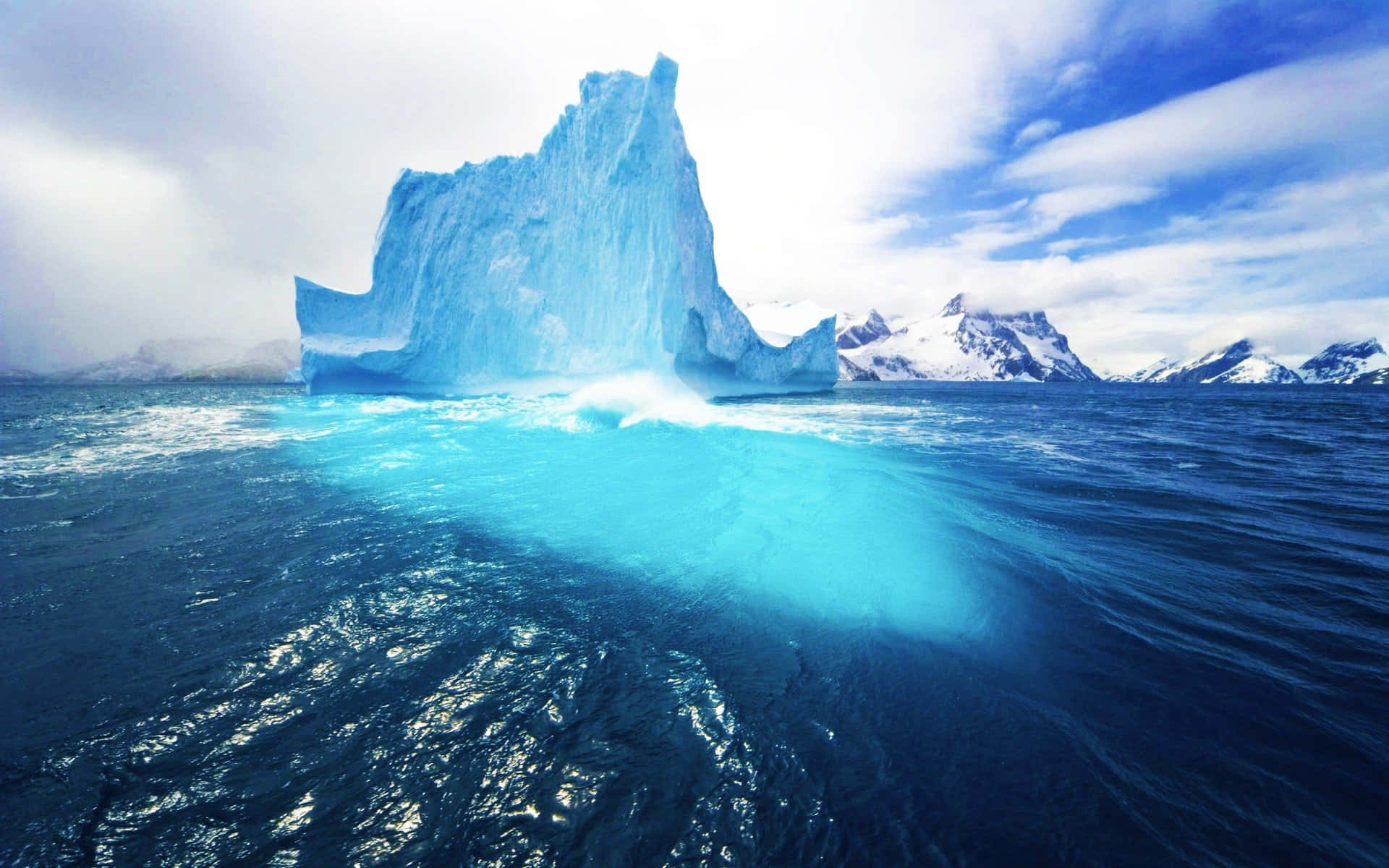 Iceberg floating in the ocean Wallpaper