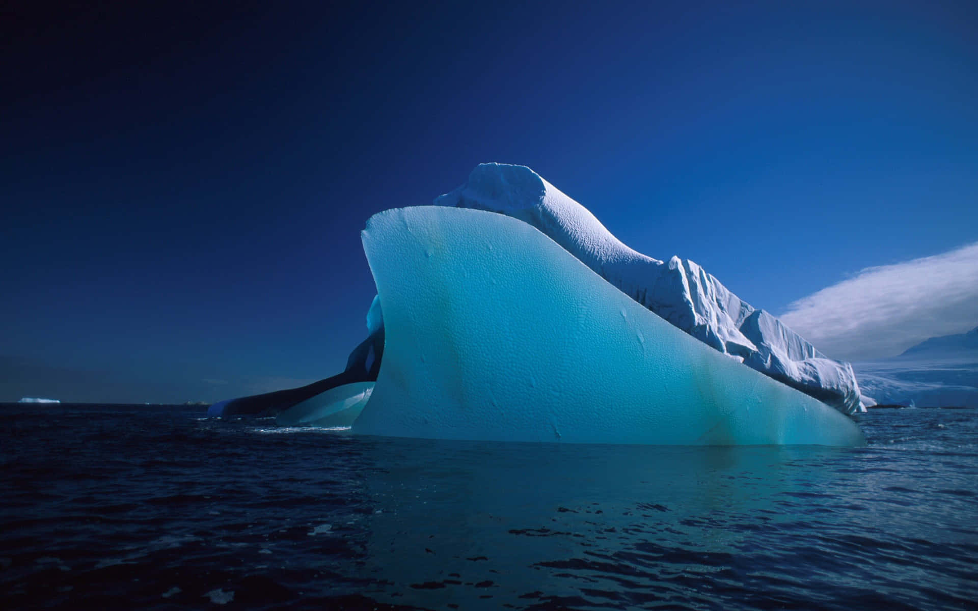 Majestic Iceberg on a Pristine Ocean Wallpaper