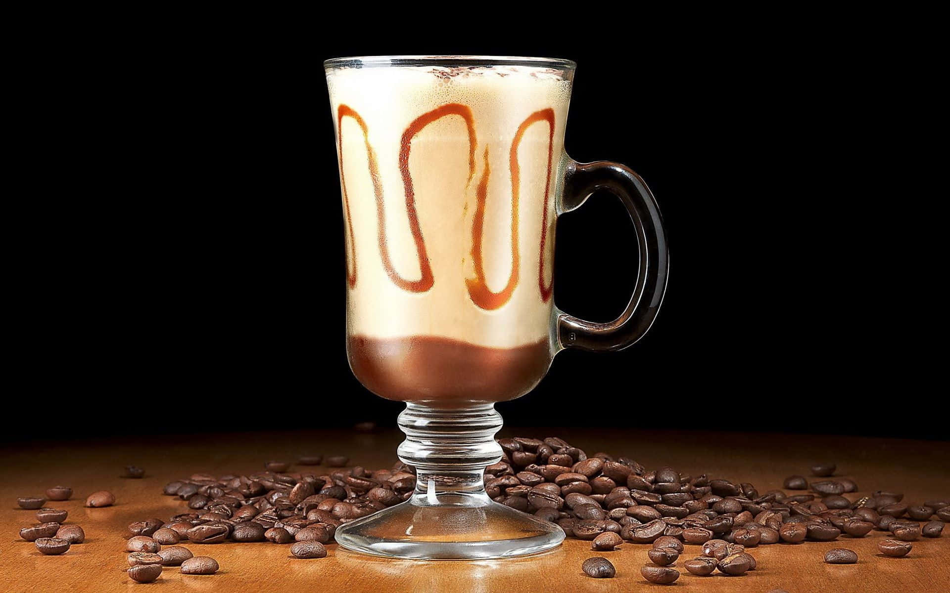 A Coffee Drink With Caramel And Chocolate On Top