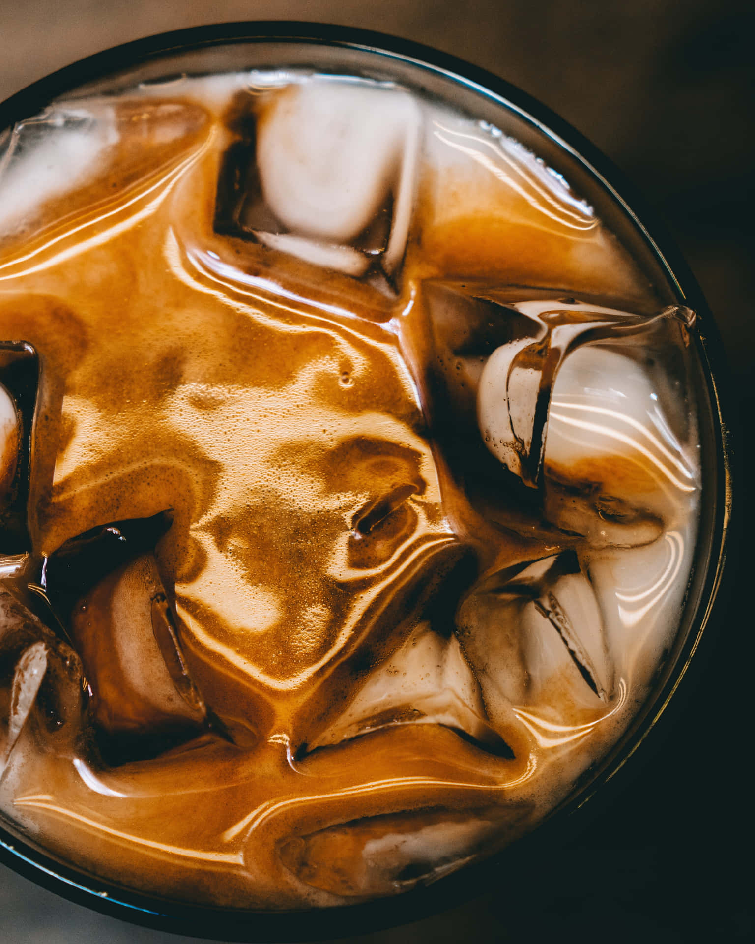 A Close Up Of A Cup Of Coffee With Ice