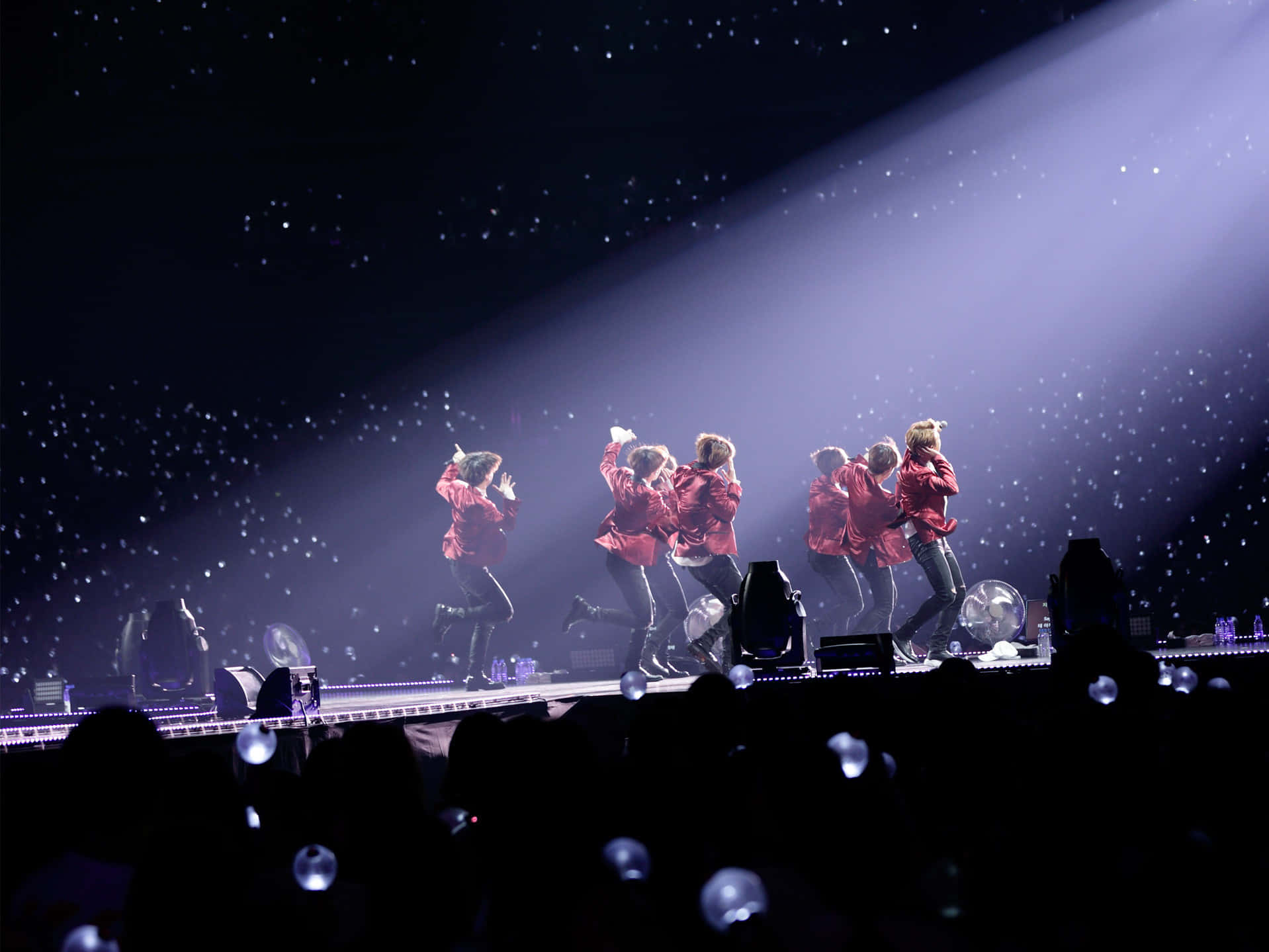 Iconic Bts Performance On Concert Stage Wallpaper