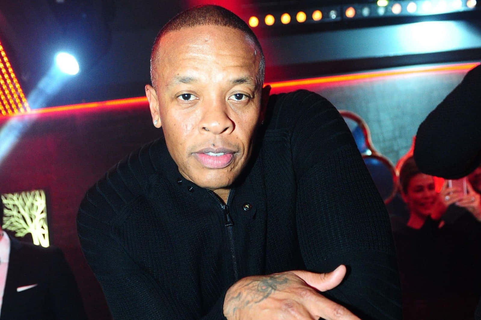 Iconic Music Producer Dr. Dre In His Studio Wallpaper