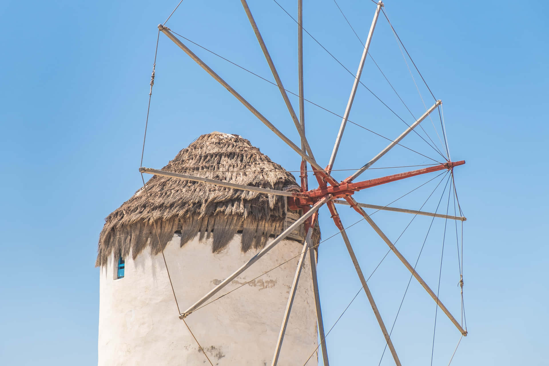 Iconic Windmills Against Mykonos' Stunning Blue Sky Wallpaper