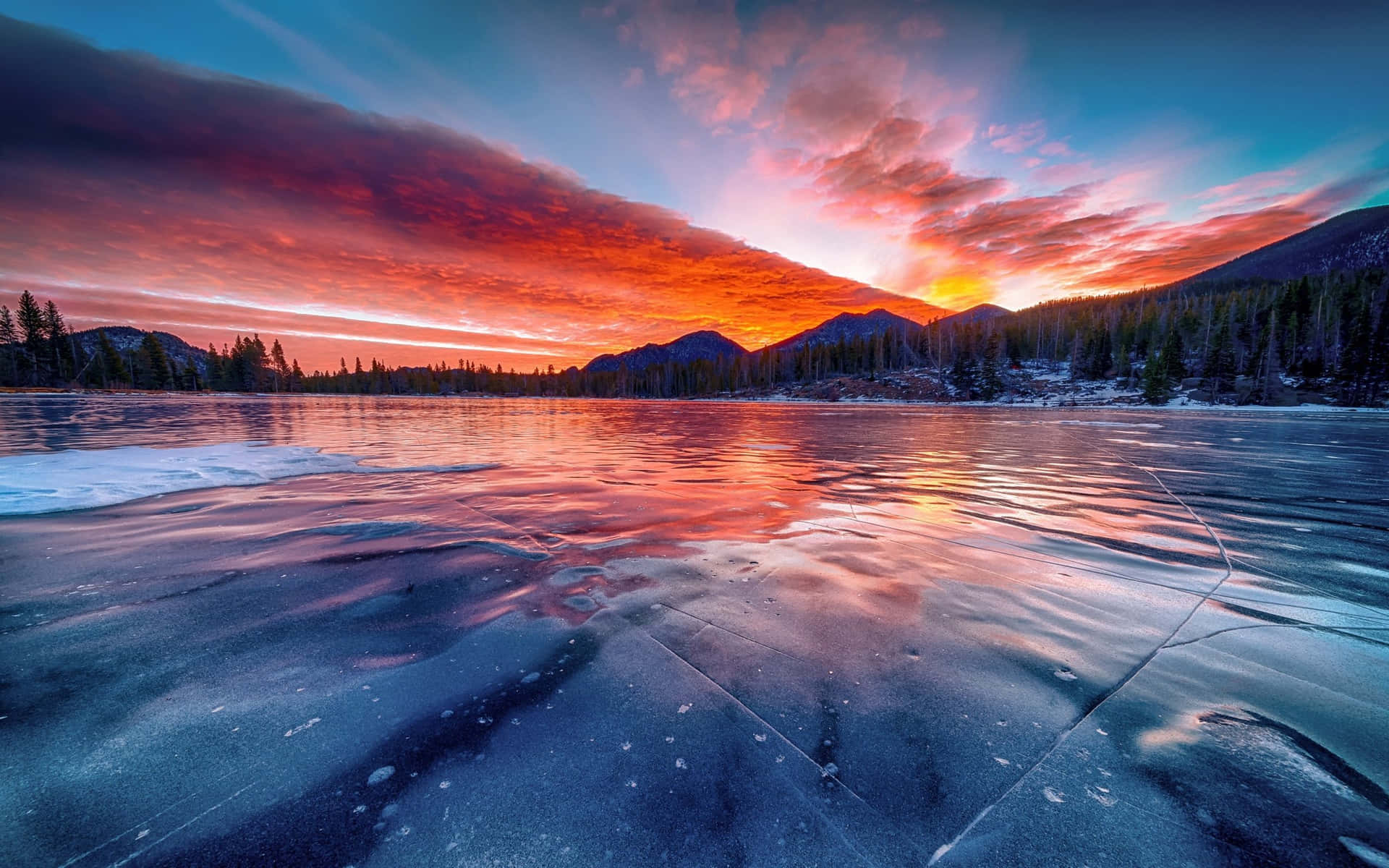 Icy Lake With Mountains Sunset Wallpaper